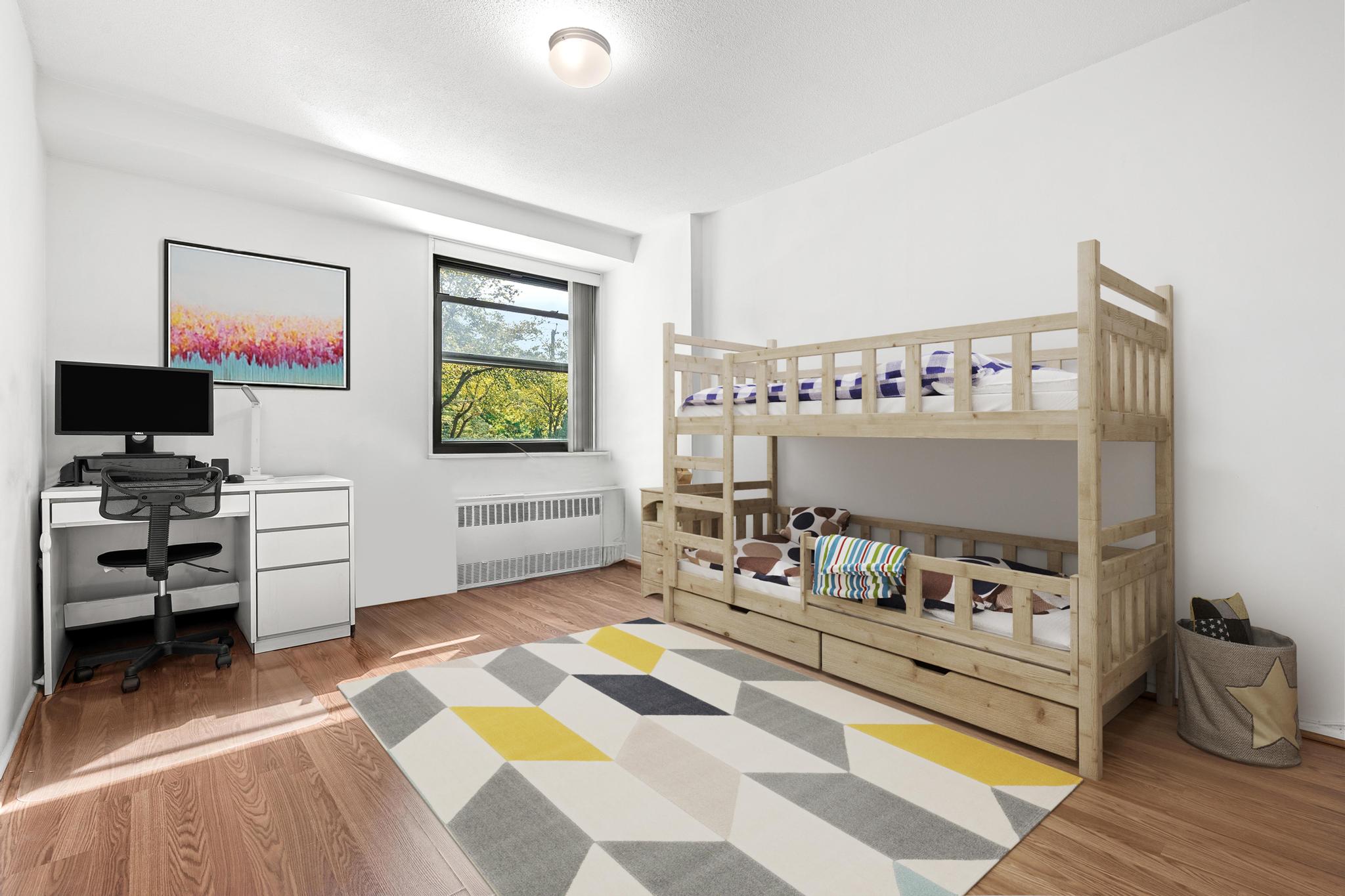 290 West 232nd Street, Unit 2C Bronx, NY 10463 - Photo 10 of 13 a living room with furniture and a flat screen tv
