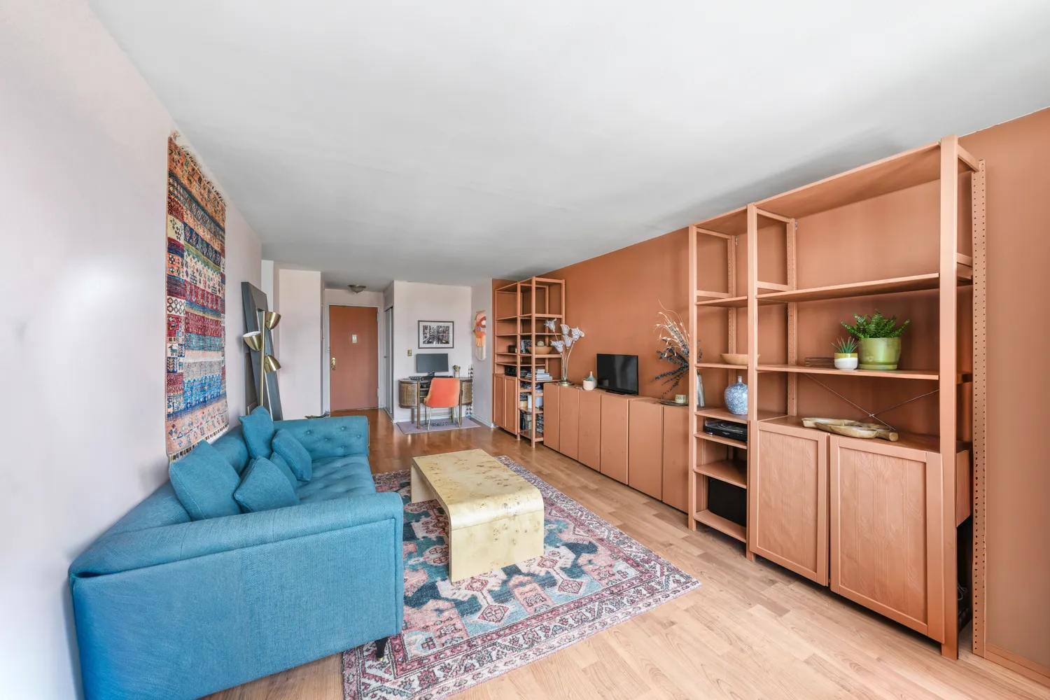 a living room with furniture and a rug
