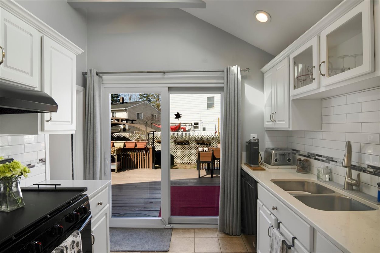 107 Kingston Road Parsippany, NJ 07054 - Photo 6 of 43 a kitchen with a sink stove and cabinets