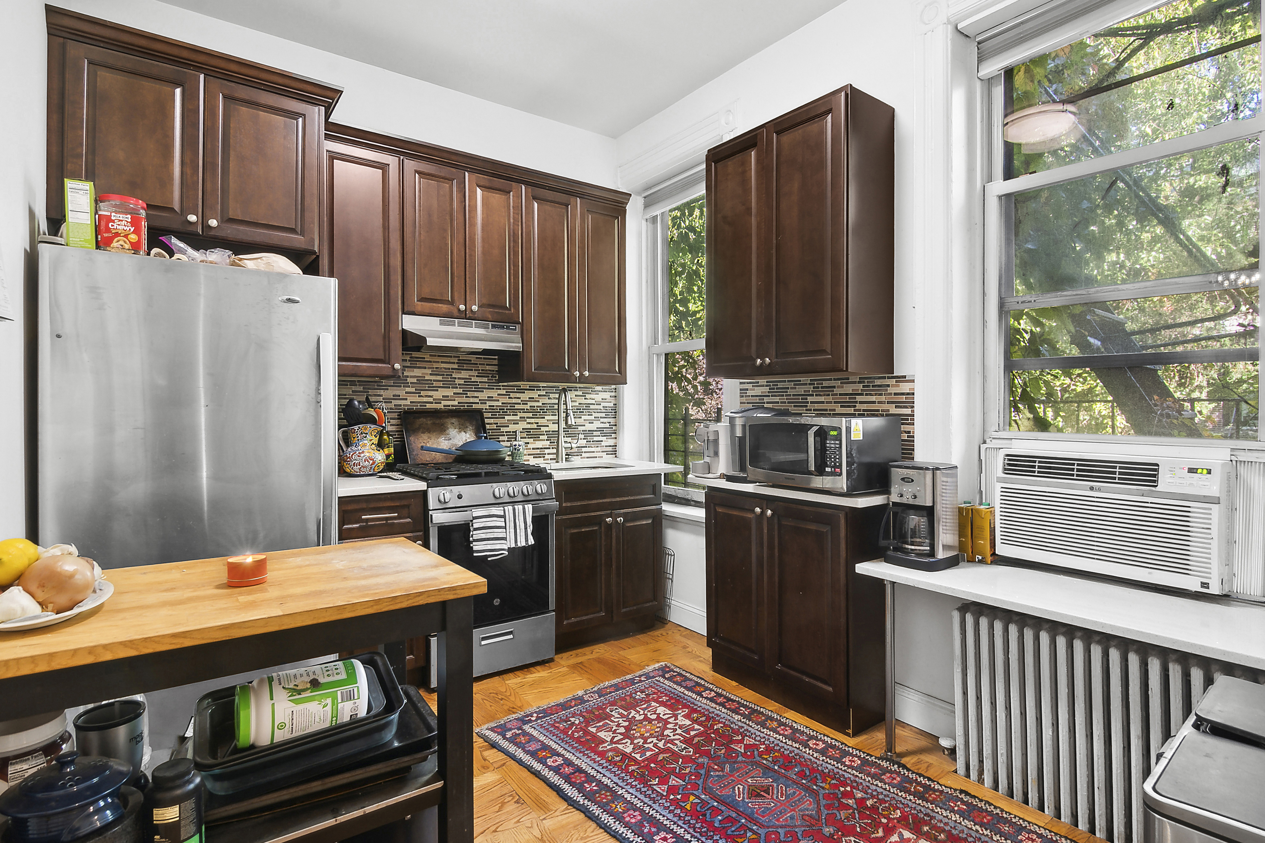 245 Baltic Street, Unit 1 Brooklyn, NY 11201 - Photo 3 of 7 a kitchen with stainless steel appliances a stove a refrigerator and a stove