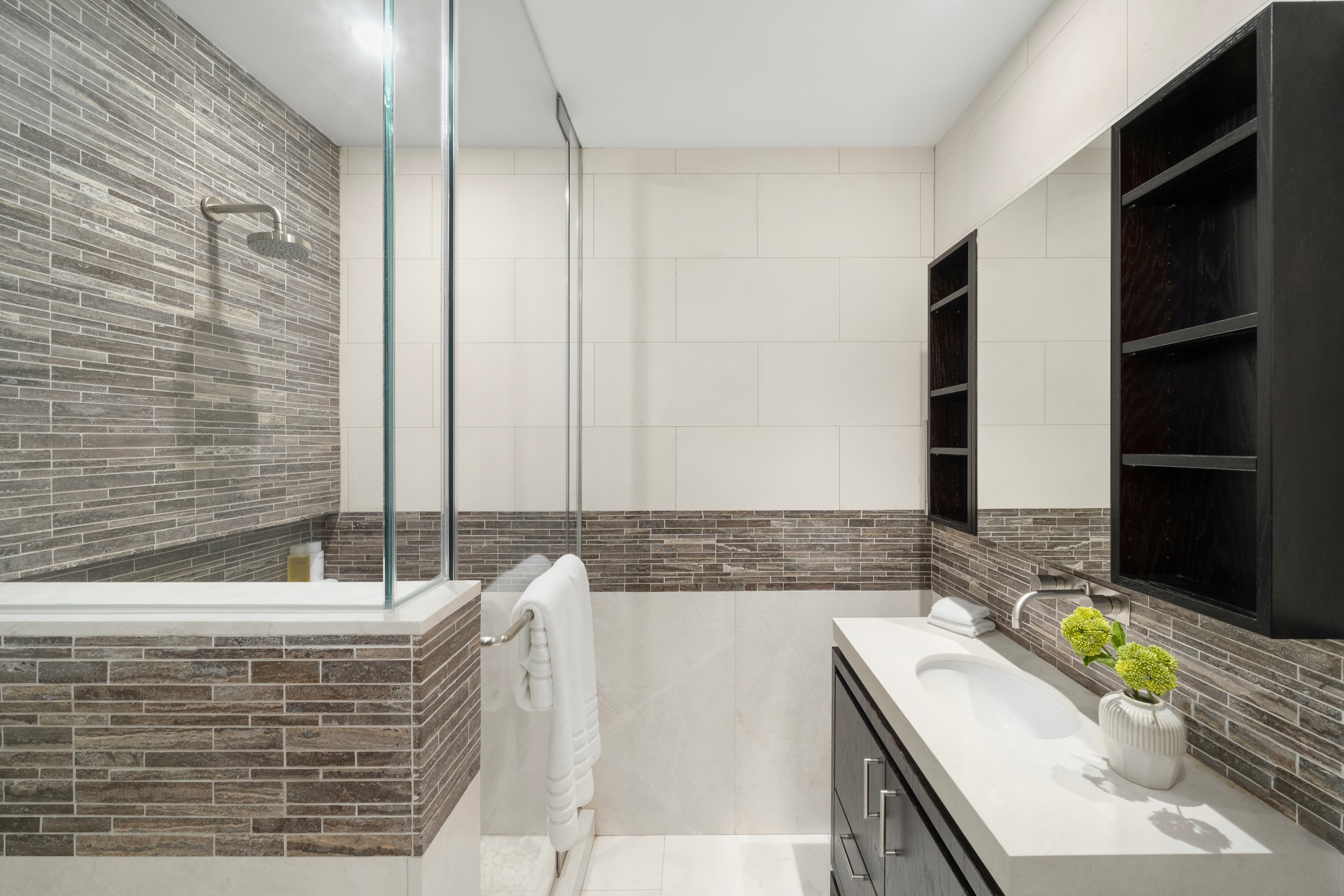 93 Worth Street, Unit PH5 Manhattan, NY 10013 - Photo 14 of 19 a bathroom with a granite countertop bathtub and a sink