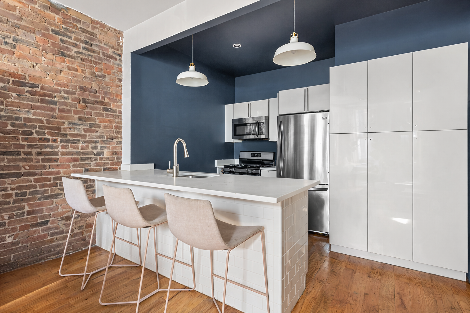 1153 Pacific Street, Unit 1 Brooklyn, NY 11216 - Photo 2 of 11 a kitchen with stainless steel appliances a sink cabinets and wooden floor