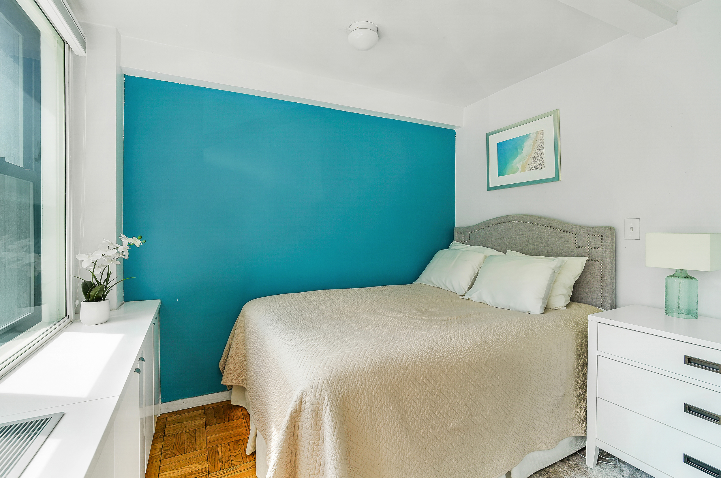 241 East 76th Street, Unit 2G Manhattan, NY 10021 - Photo 4 of 11 a bedroom with a bed and a dresser