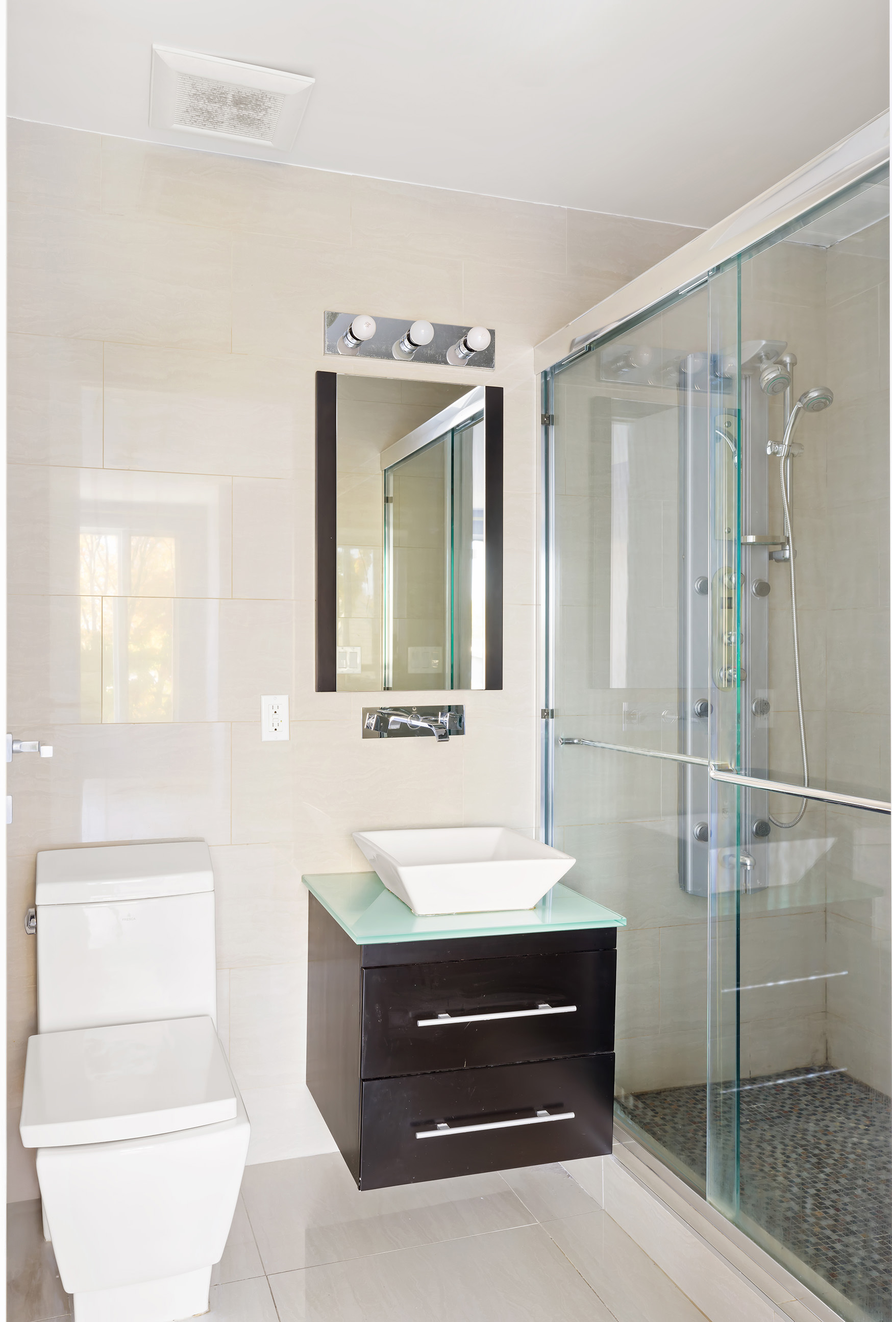 1972 Ocean Avenue, Unit 4A Brooklyn, NY 11230 - Photo 15 of 18 a bathroom with a sink a toilet and shower