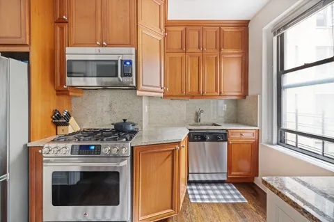 a kitchen with a stove and a microwave