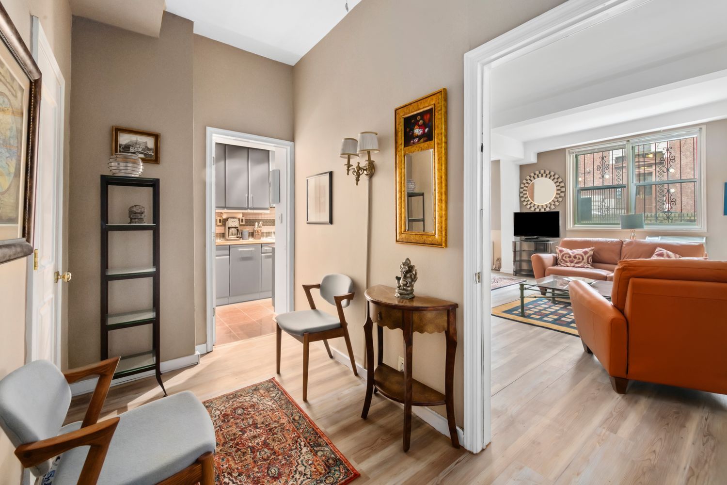 345 East 54th Street Manhattan, NY 10022 - Photo 4 of 10 a living room with furniture and a window
