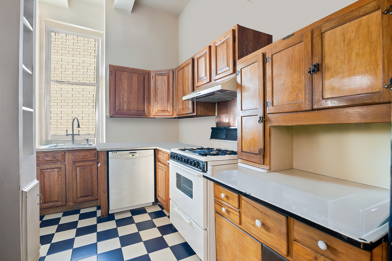41 Eastern Parkway, Unit 1D Brooklyn, NY 11238 - Photo 5 of 16 a kitchen with stainless steel appliances granite countertop a stove a sink and a microwave