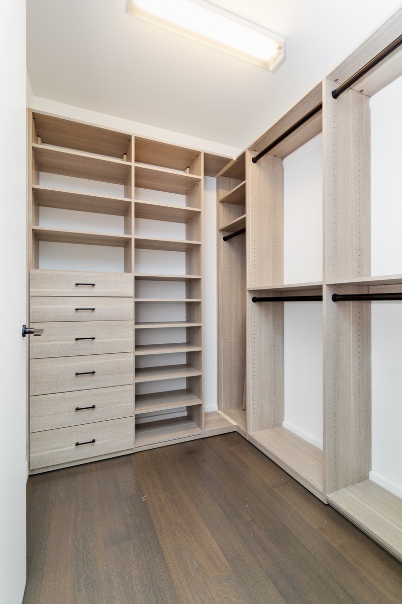 111 Murray Street, Unit 16B Manhattan, NY 10007 - Photo 11 of 22 a view of walk in closet with empty racks