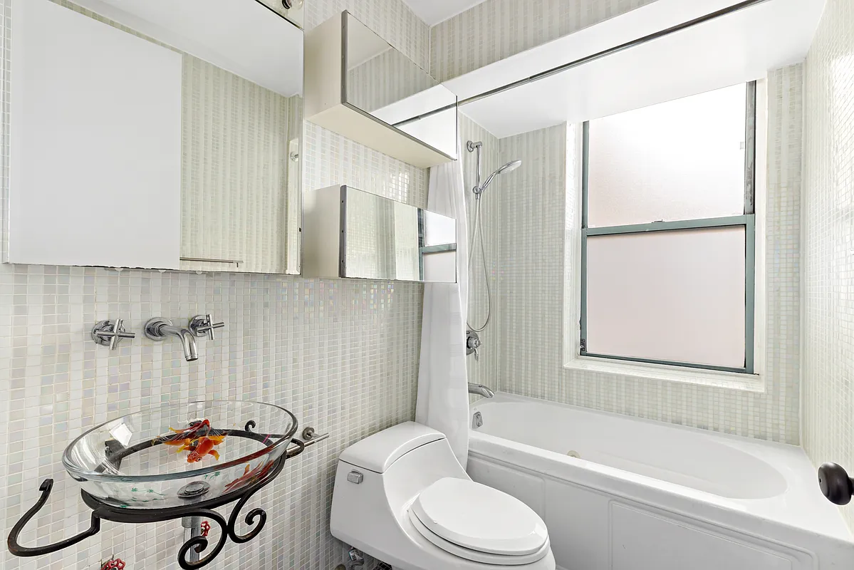 21 South End Avenue, Unit PH2BB Manhattan, NY 10280 - Photo 4 of 5 a bathroom with a sink a toilet and shower