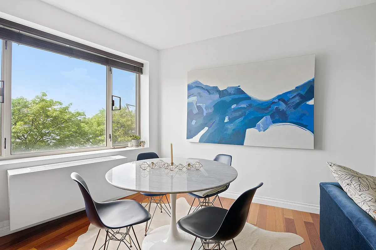 30-85 Vernon Boulevard, Unit 3M Queens, NY 11102 - Photo 2 of 8 a dining room with furniture and wooden floor