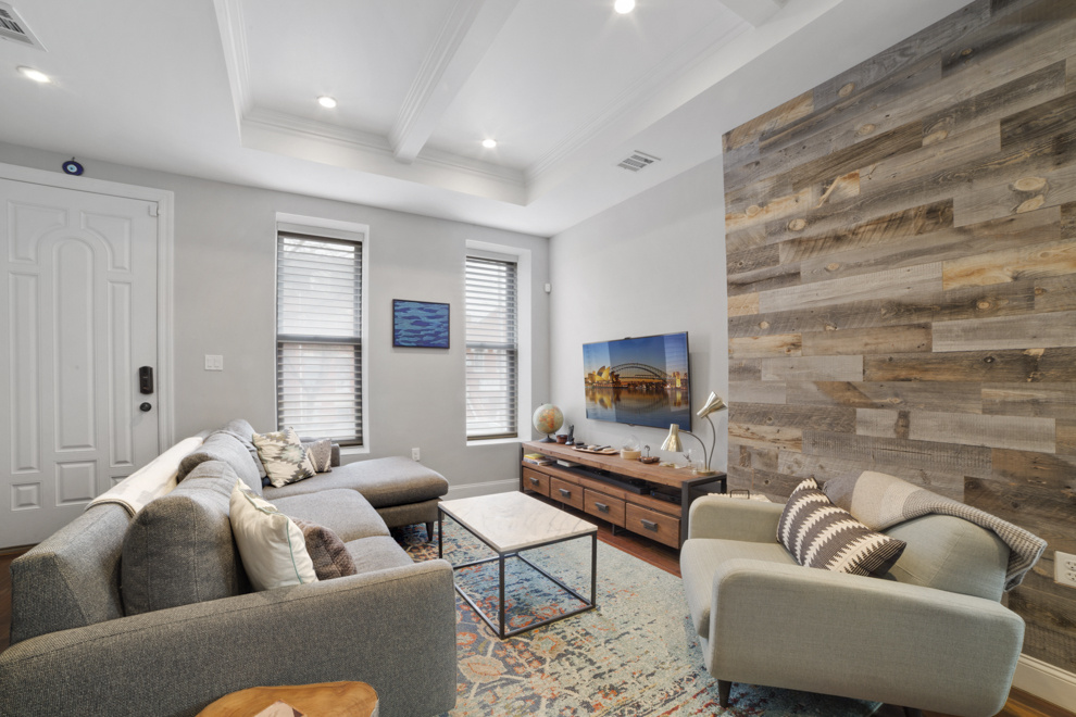 730 Quincy Street, Unit 2 Brooklyn, NY 11221 - Photo 1 of 11 a living room with furniture and a flat screen tv
