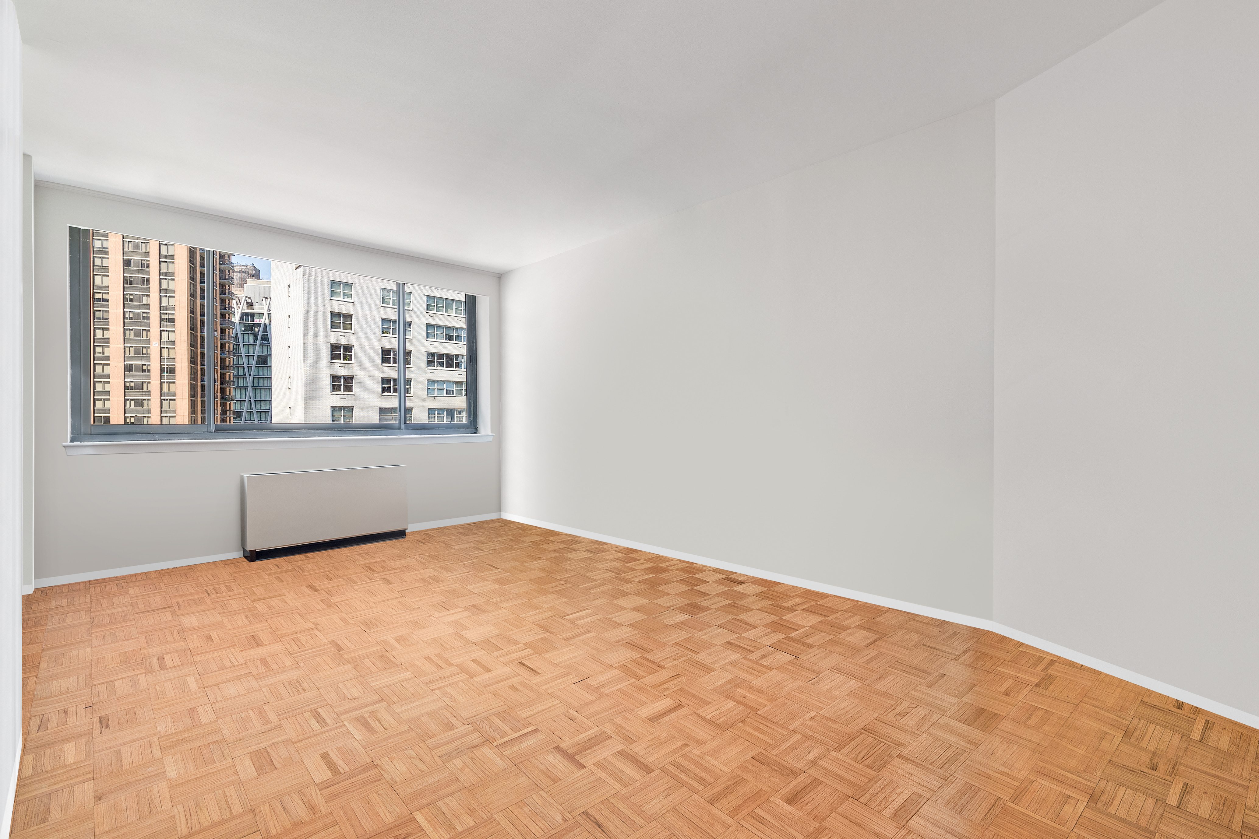 2000 Broadway, Unit 8I Manhattan, NY 10023 - Photo 6 of 9 an empty room with a window