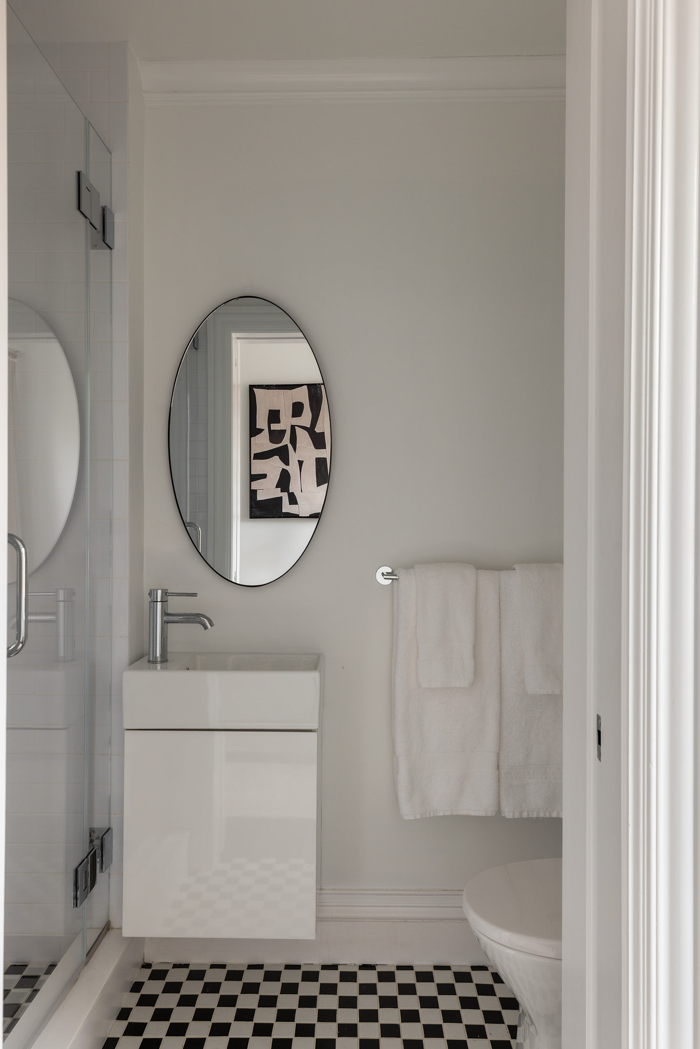 350 East 57th Street, Unit 15B Manhattan, NY 10022 - Photo 7 of 20 a bathroom with a sink a toilet and a mirror