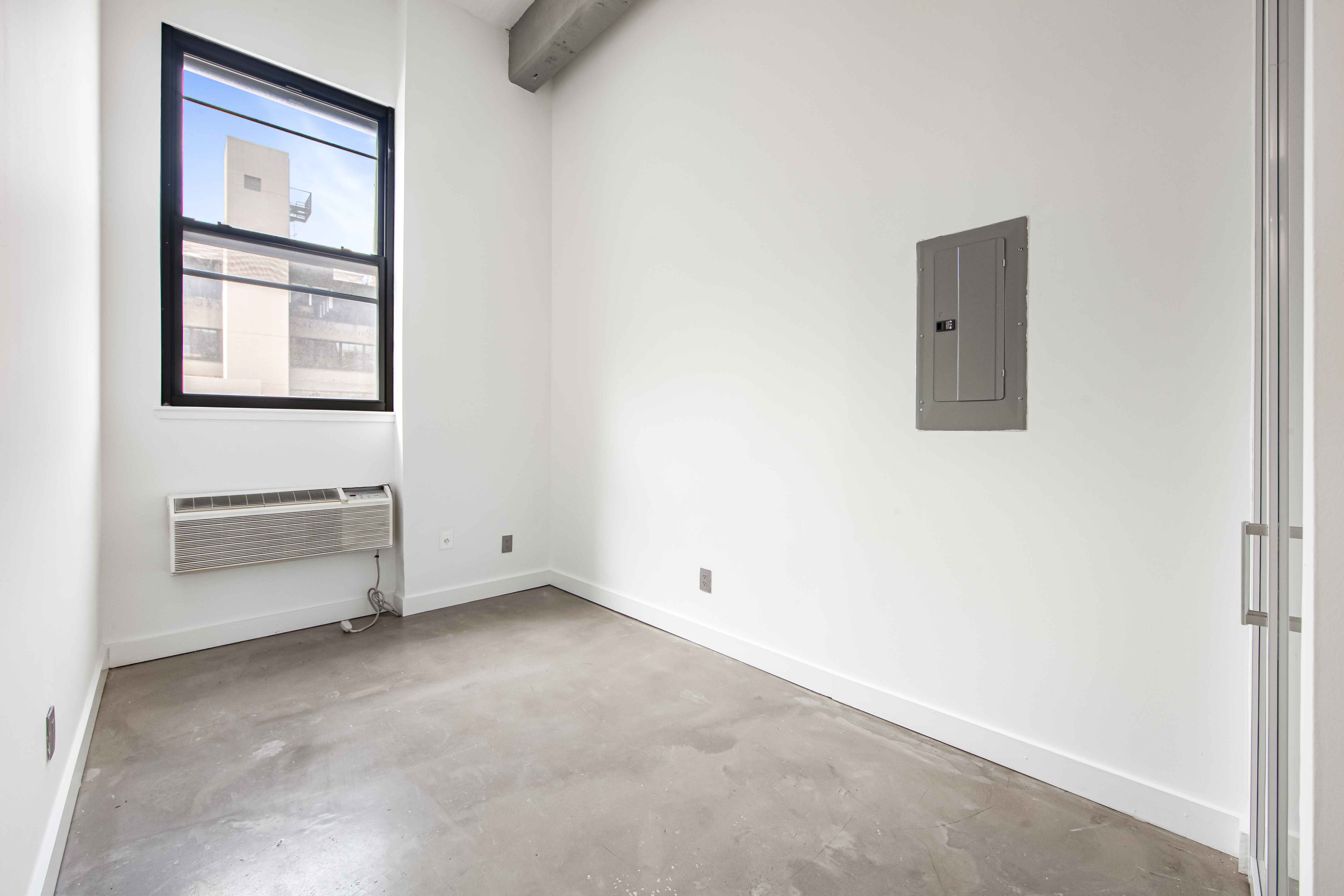 44 Berry Street, Unit 2K Brooklyn, NY 11249 - Photo 5 of 6 a view of an empty room with a window