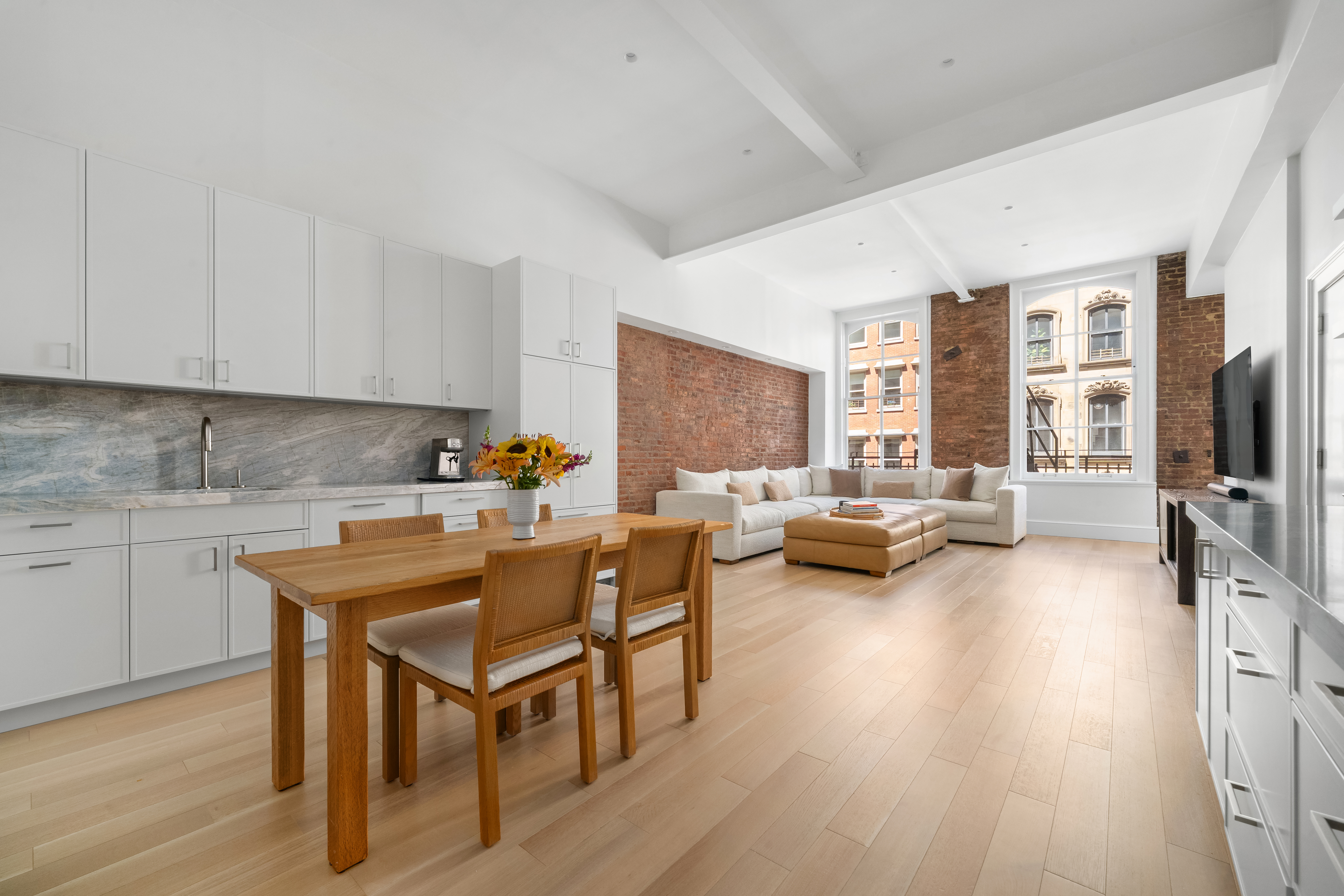51 Warren Street, Unit 3W Manhattan, NY 10007 - Photo 6 of 13 a living room with furniture and a flat screen tv