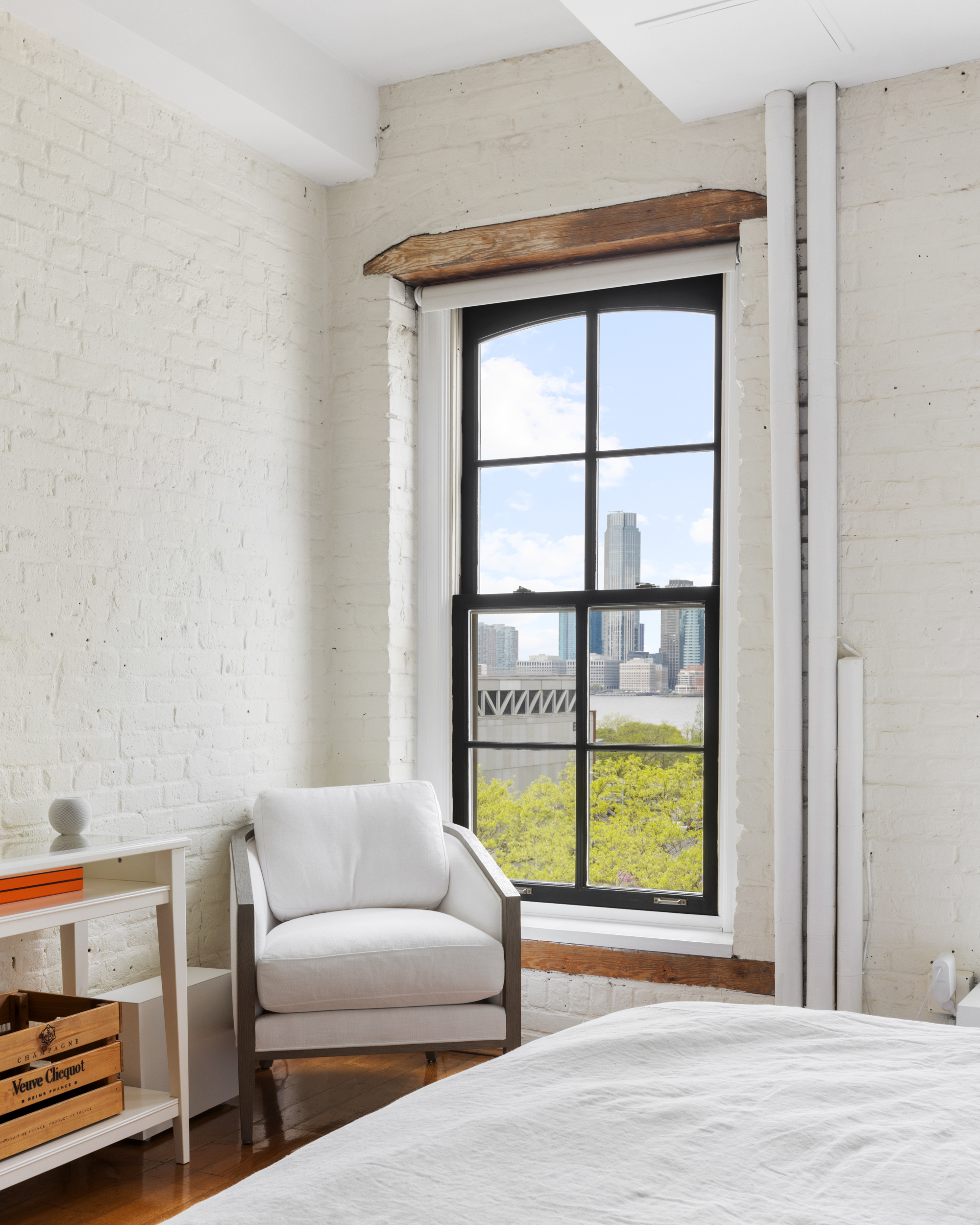 62 Beach Street, Unit 5E Manhattan, NY 10013 - Photo 9 of 15 a living room with furniture and a window