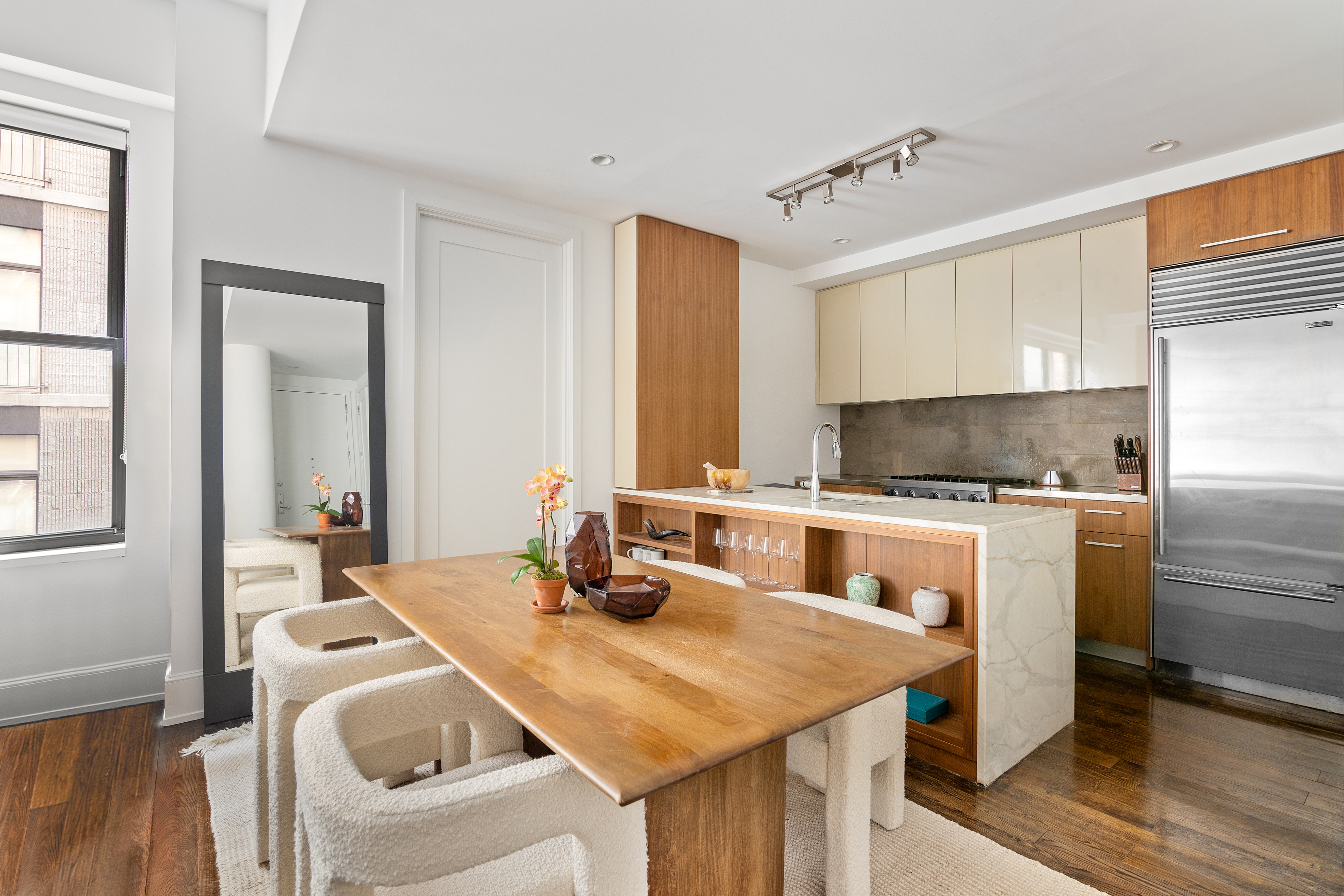 260 Park Avenue South, Unit 6I Manhattan, NY 10010 - Photo 2 of 9 a kitchen with a sink and a refrigerator