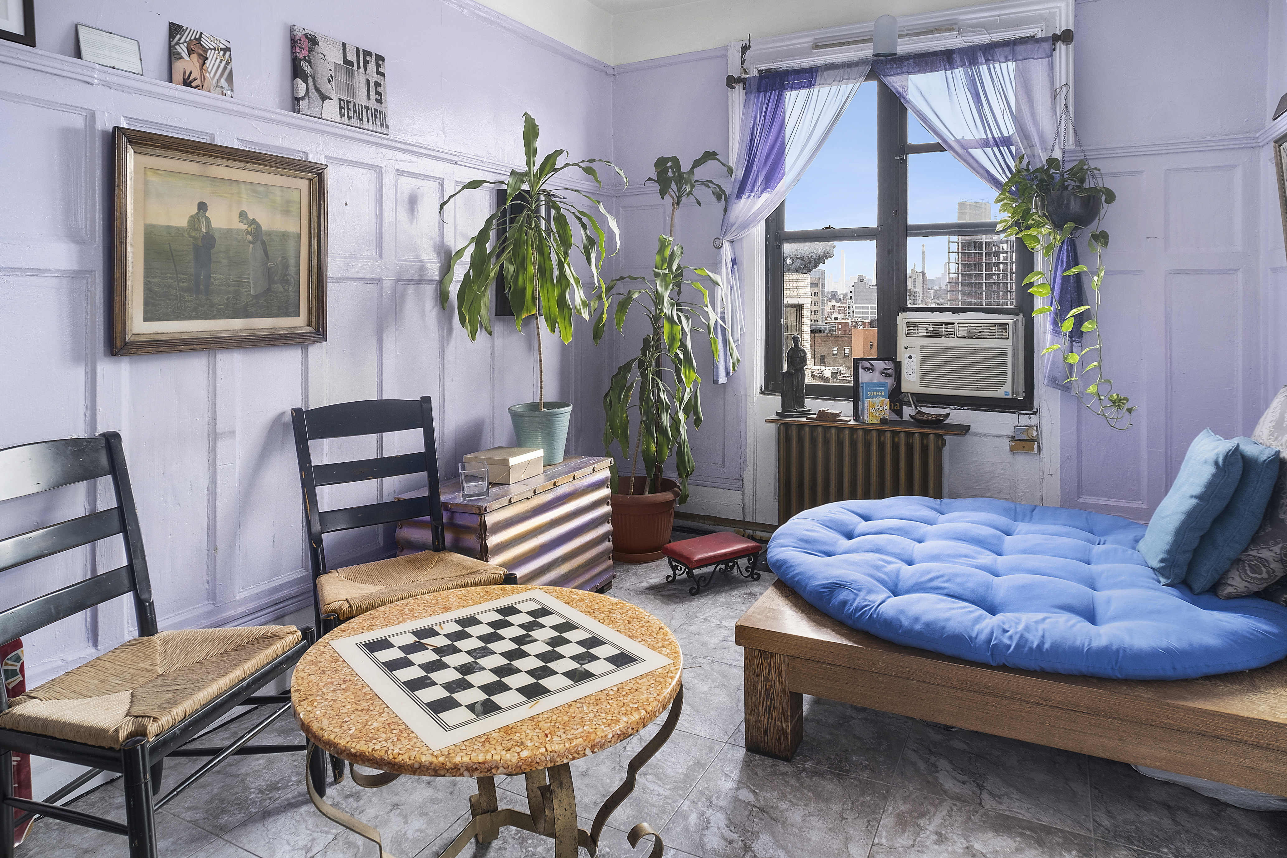 a bedroom with furniture and a window