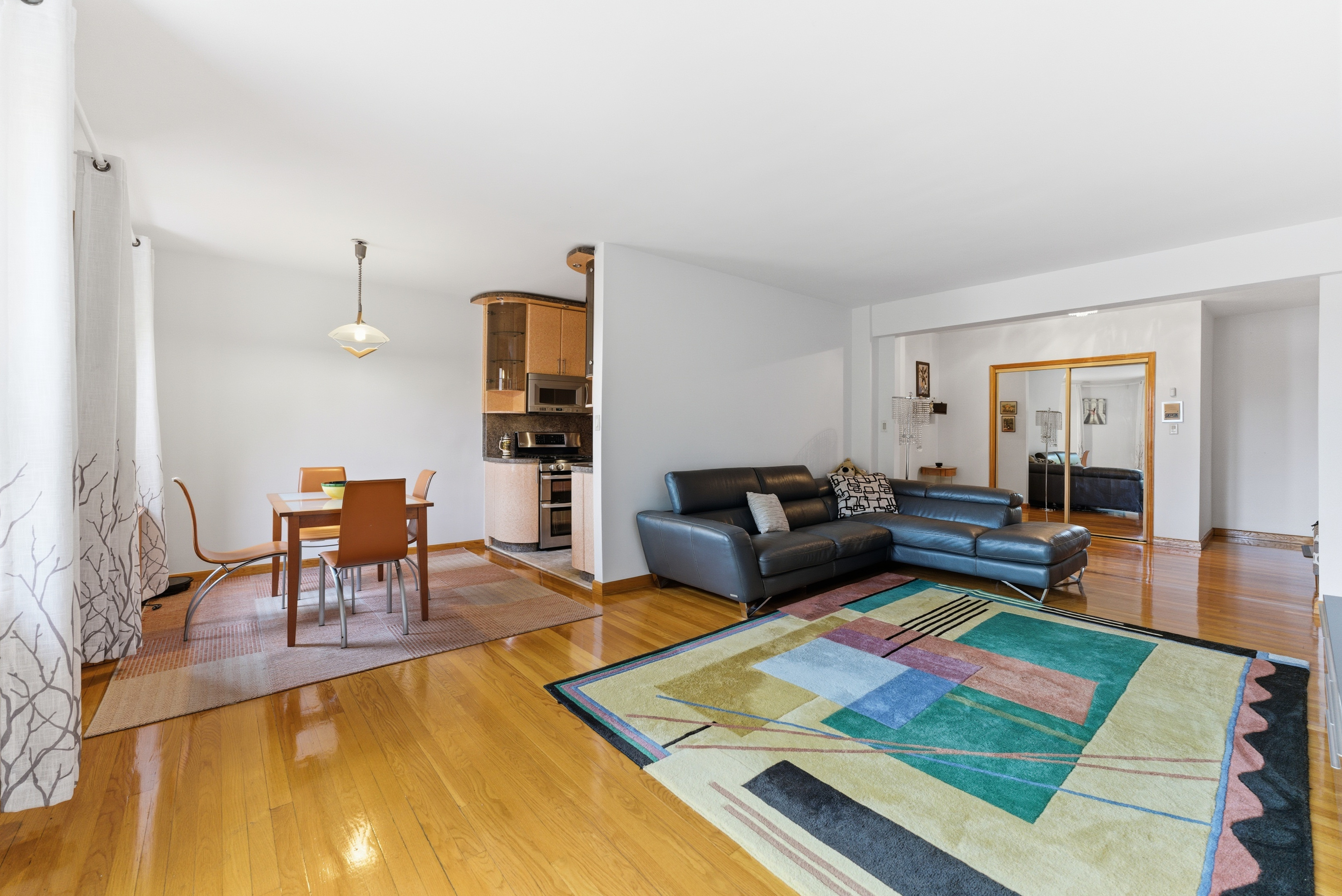3616 Henry Hudson Parkway, Unit 7GN Bronx, NY 10463 - Photo 2 of 17 a living room with furniture and a rug
