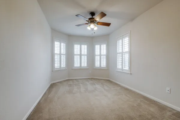 a view of a room with wooden walls