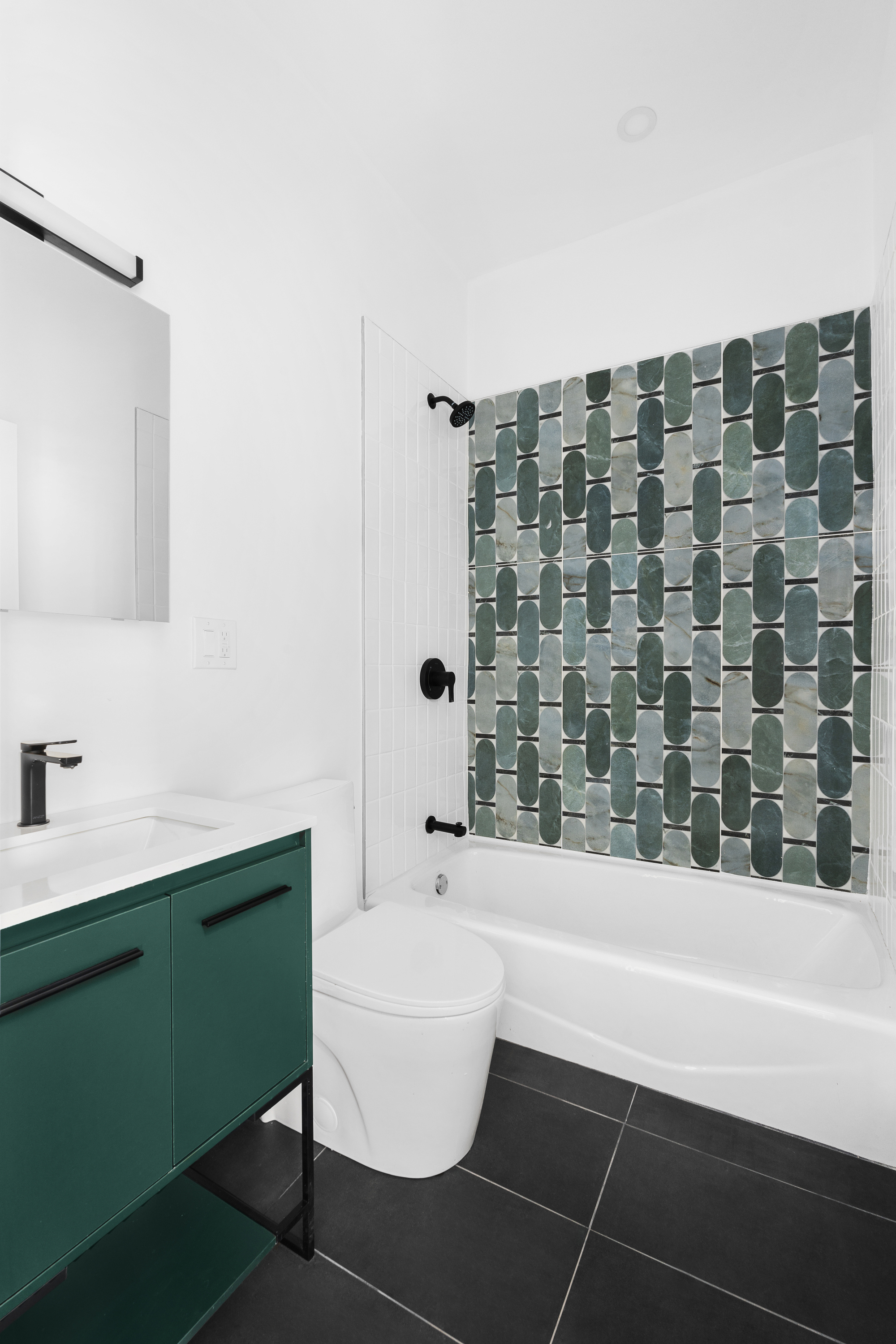92 Wilson Avenue Brooklyn, NY 11237 - Photo 9 of 15 a bathroom with a bathtub and a sink