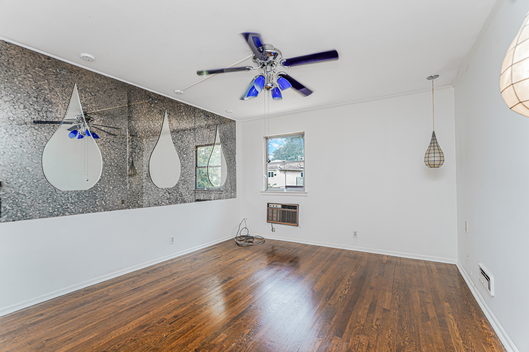 461 Mayfair Drive South Brooklyn, NY 11234 - Photo 11 of 30 a view of a livingroom with wooden floor and a ceiling fan