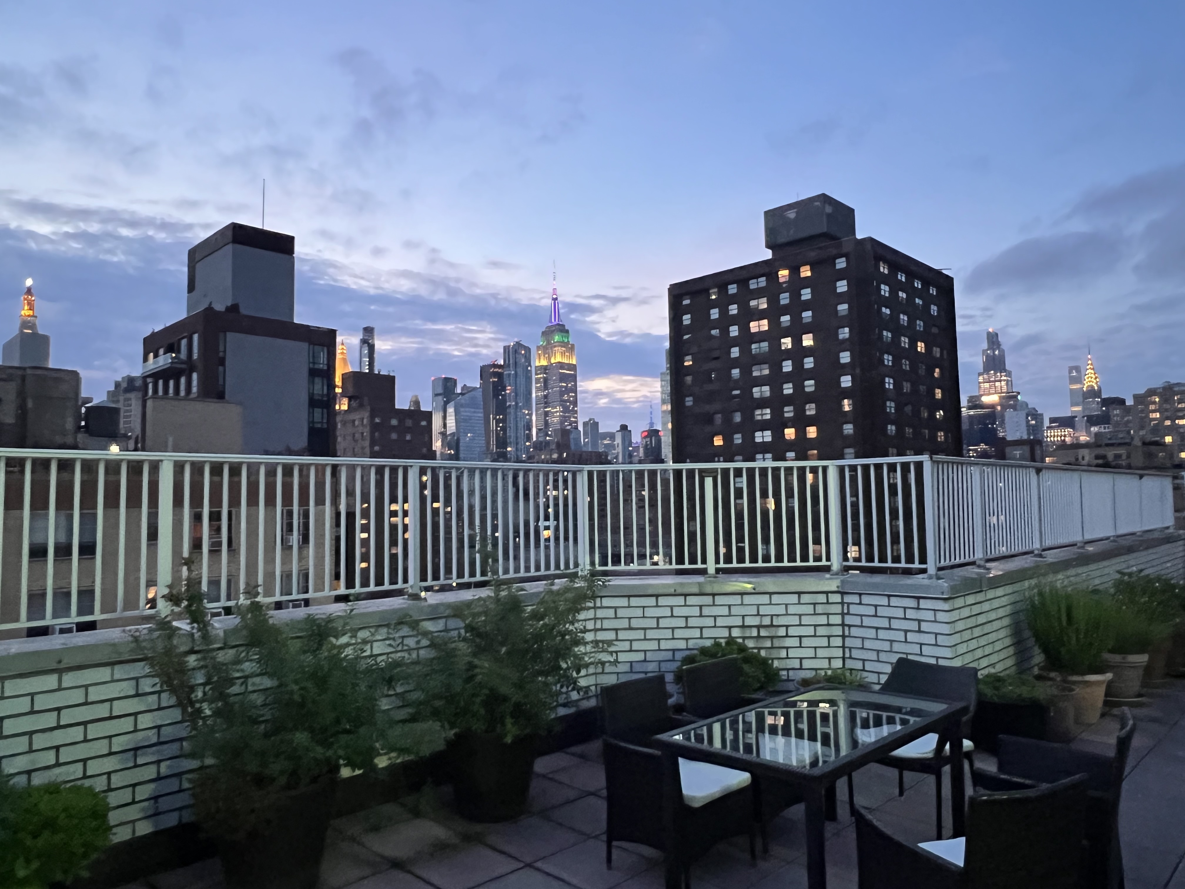 301 East 22nd Street, Unit 2H Manhattan, NY 10010 - Photo 16 of 16 a view of a balcony with a chair and wooden floor