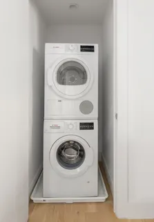 a close up view of a washer and dryer in a utility room