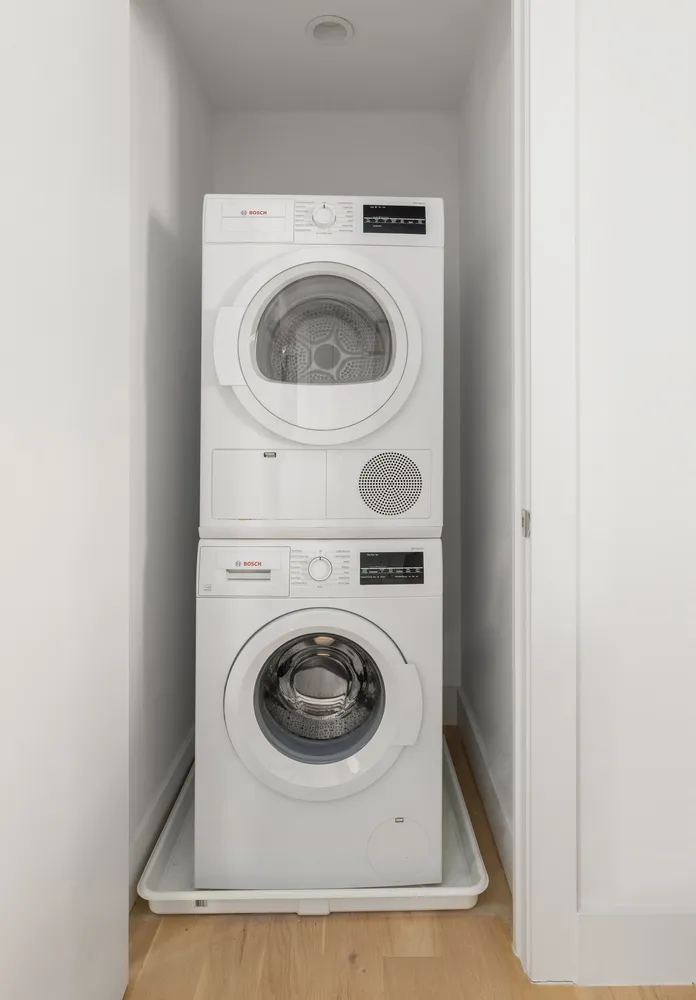a close up view of a washer and dryer in a utility room
