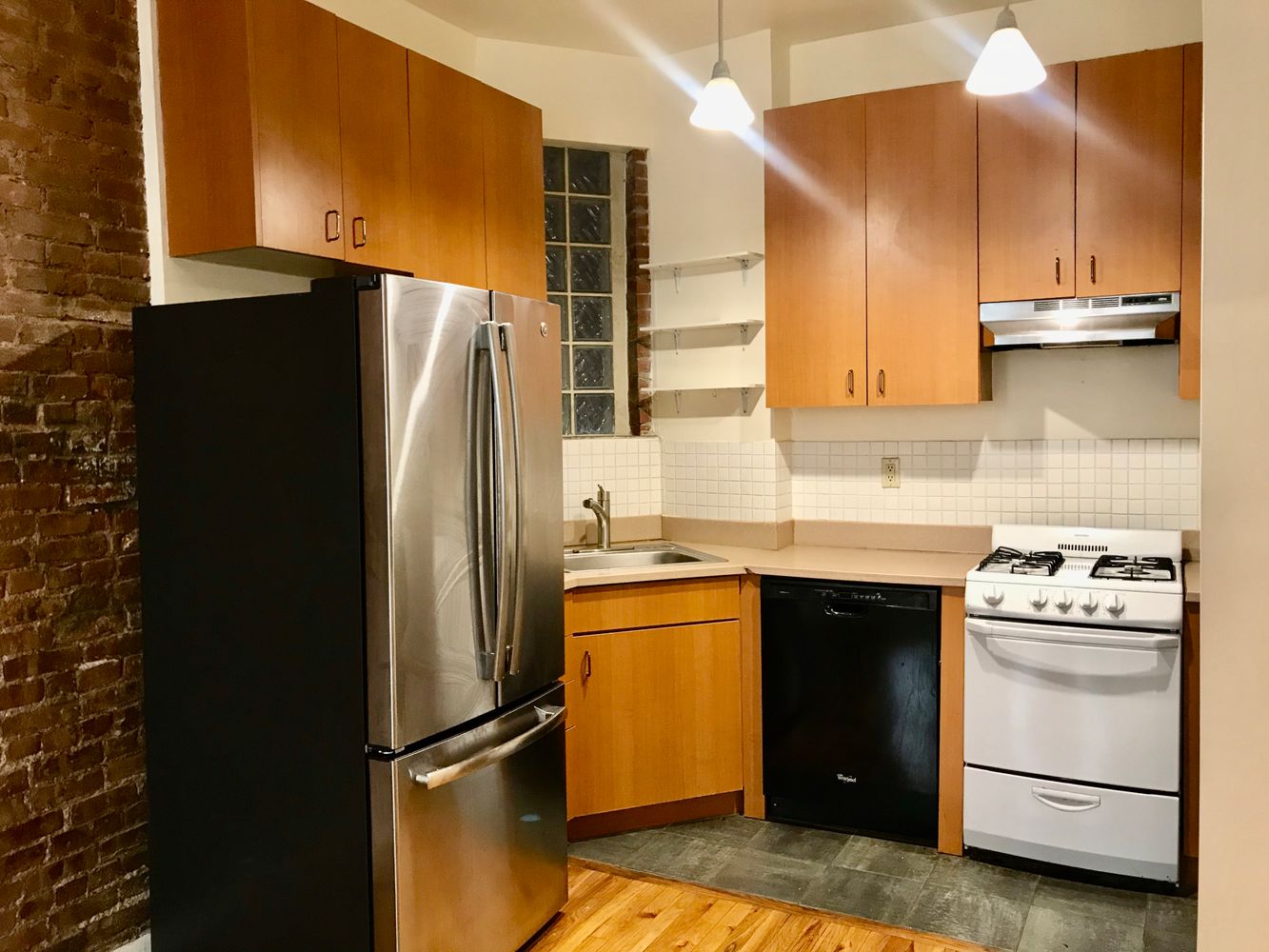 1672 Park Avenue Manhattan, NY 10035 - Photo 9 of 35 a kitchen with stainless steel appliances granite countertop a refrigerator a stove and a sink