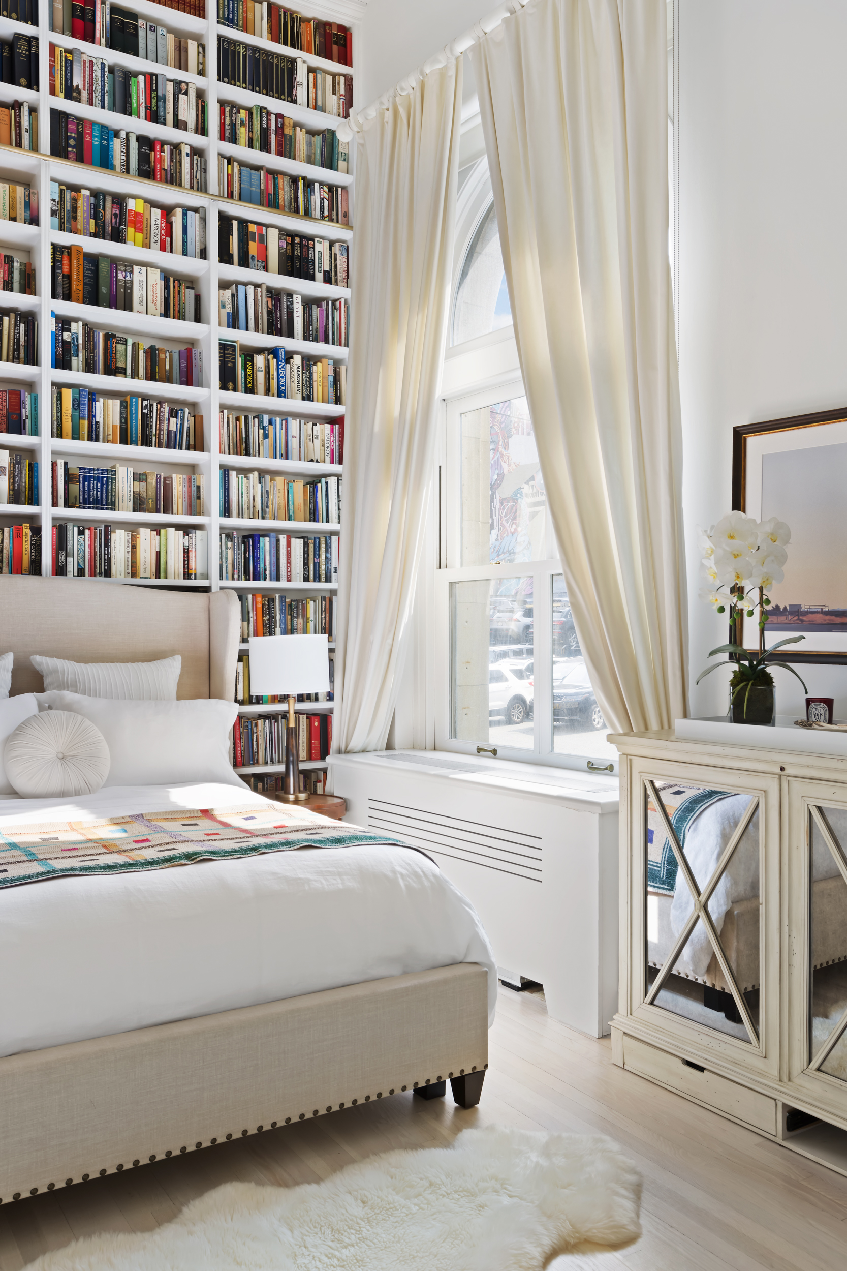 240 Centre Street, Unit 2J Manhattan, NY 10013 - Photo 9 of 18 a bedroom with a bed and a window with the outer view