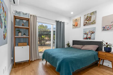 a bedroom with a bed and a book shelf