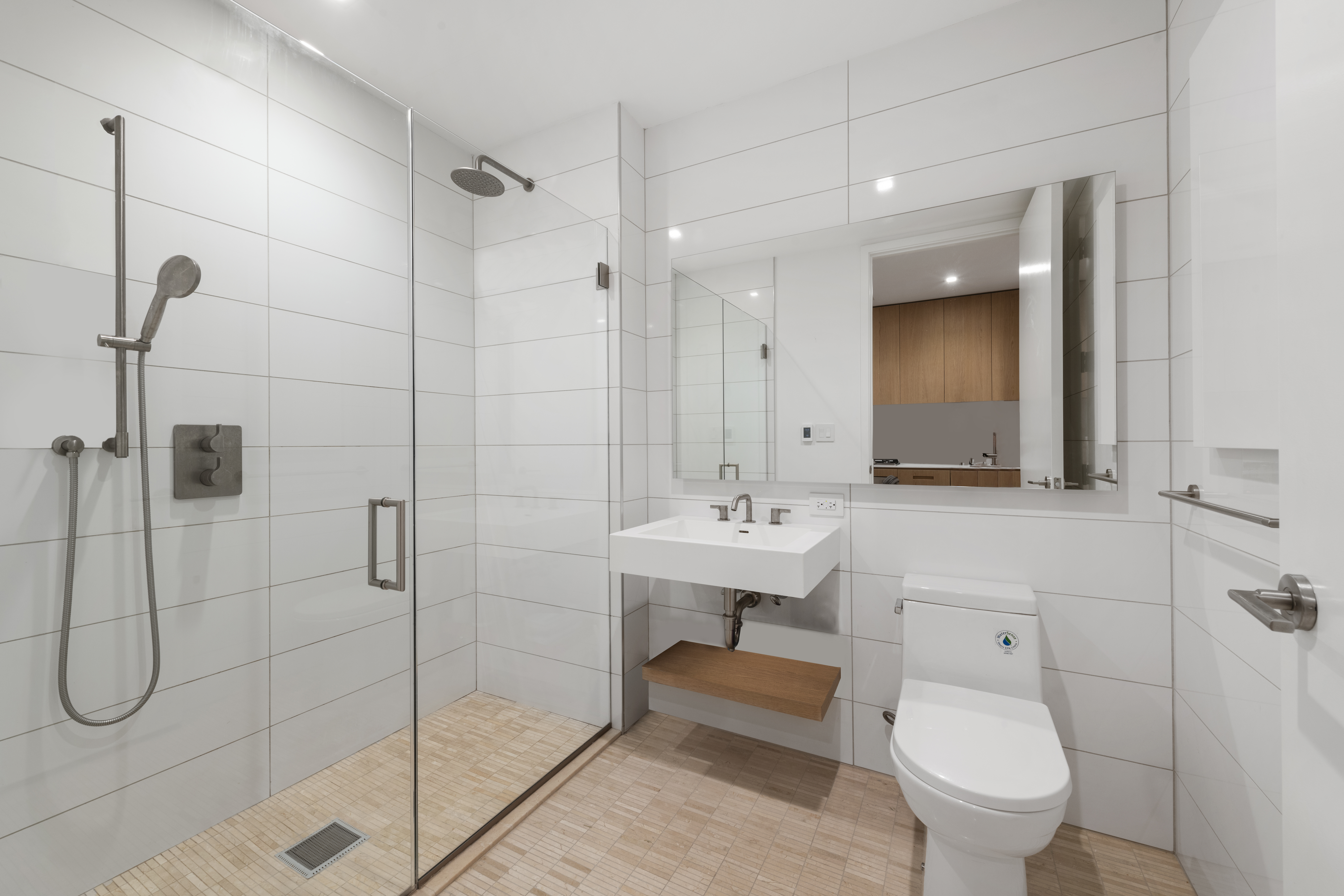98 Front Street, Unit 4A Brooklyn, NY 11201 - Photo 4 of 6 a bathroom with a sink toilet and shower