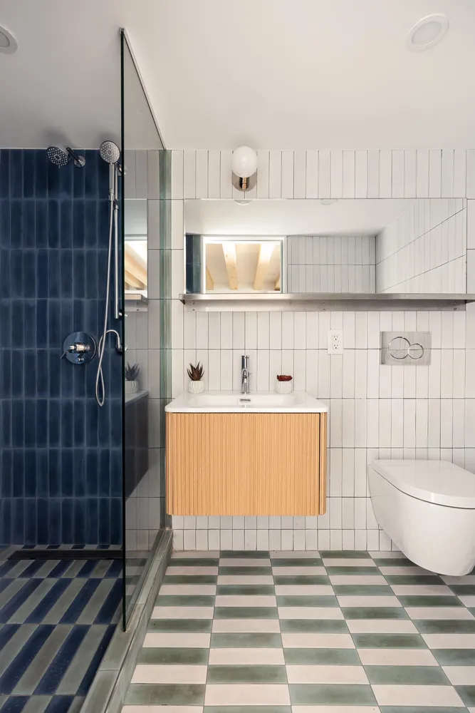 a bathroom with a bathtub and shower