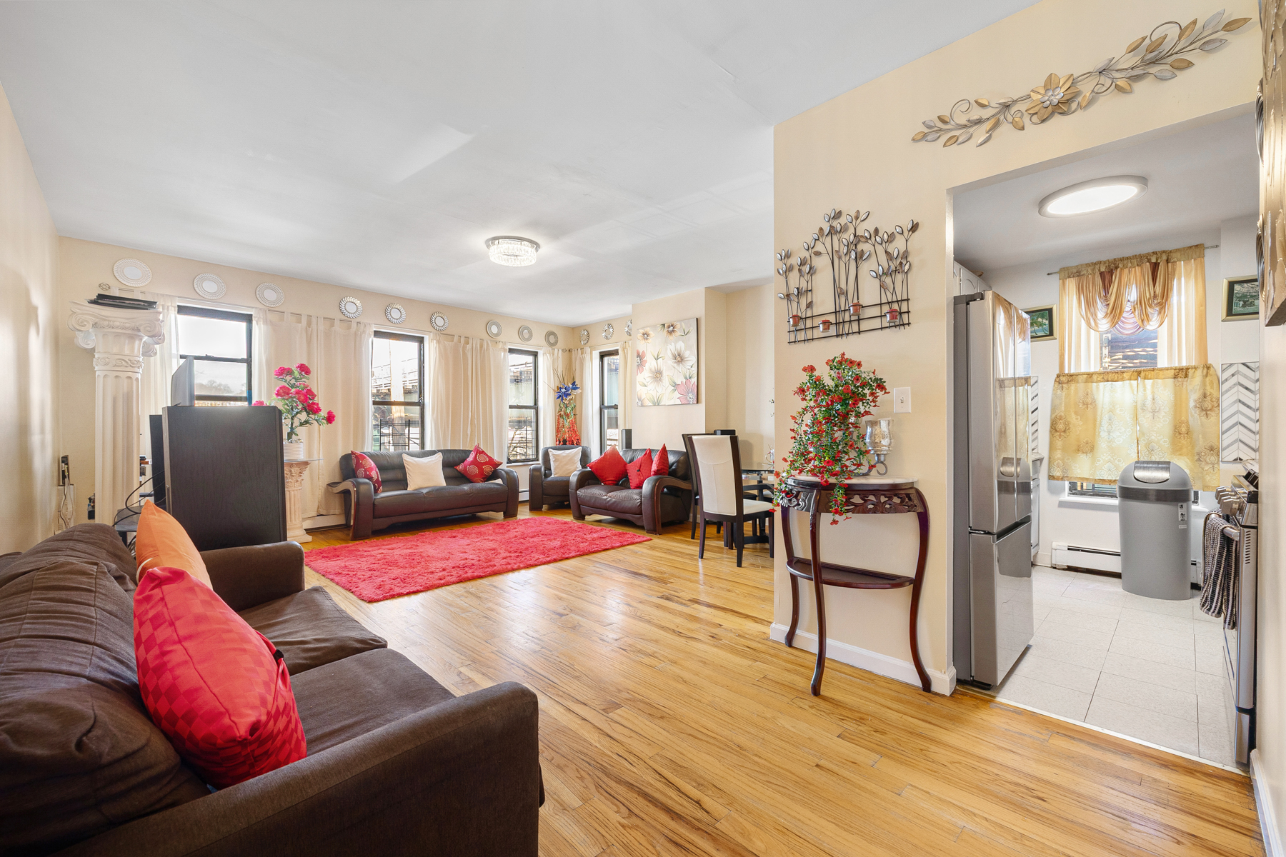 106 Crescent Street Brooklyn, NY 11208 - Photo 4 of 18 a living room with furniture and a wooden floor