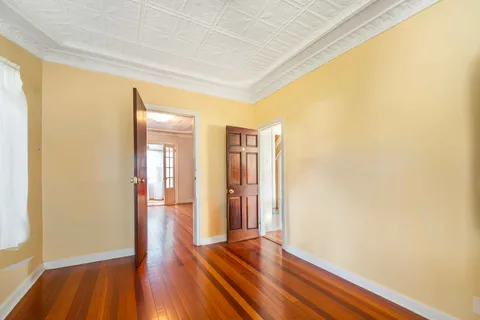 a view of wooden floor in an empty room