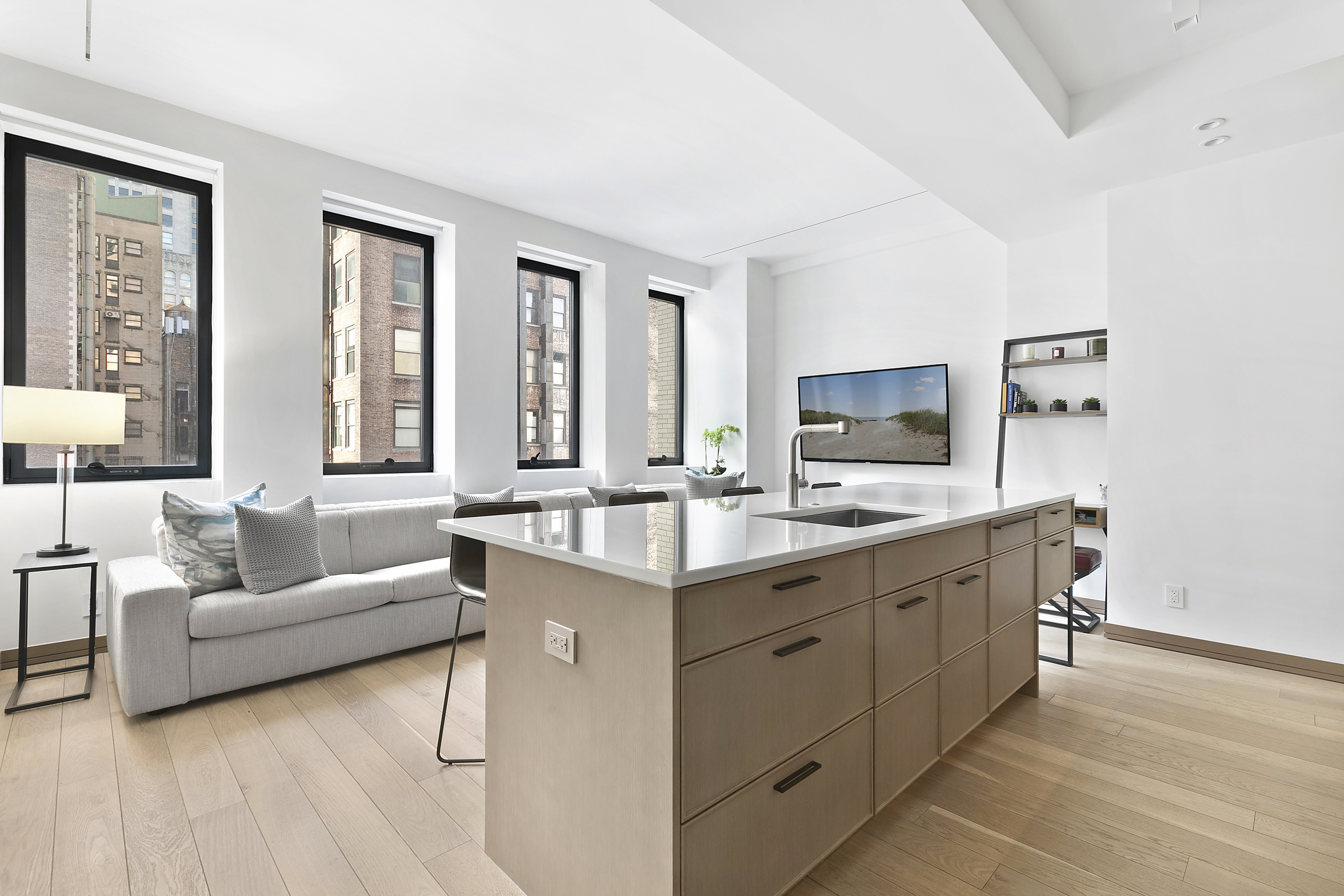 88 Lexington Avenue, Unit 802 Manhattan, NY 10016 - Photo 1 of 22 a living room with furniture and a flat screen tv