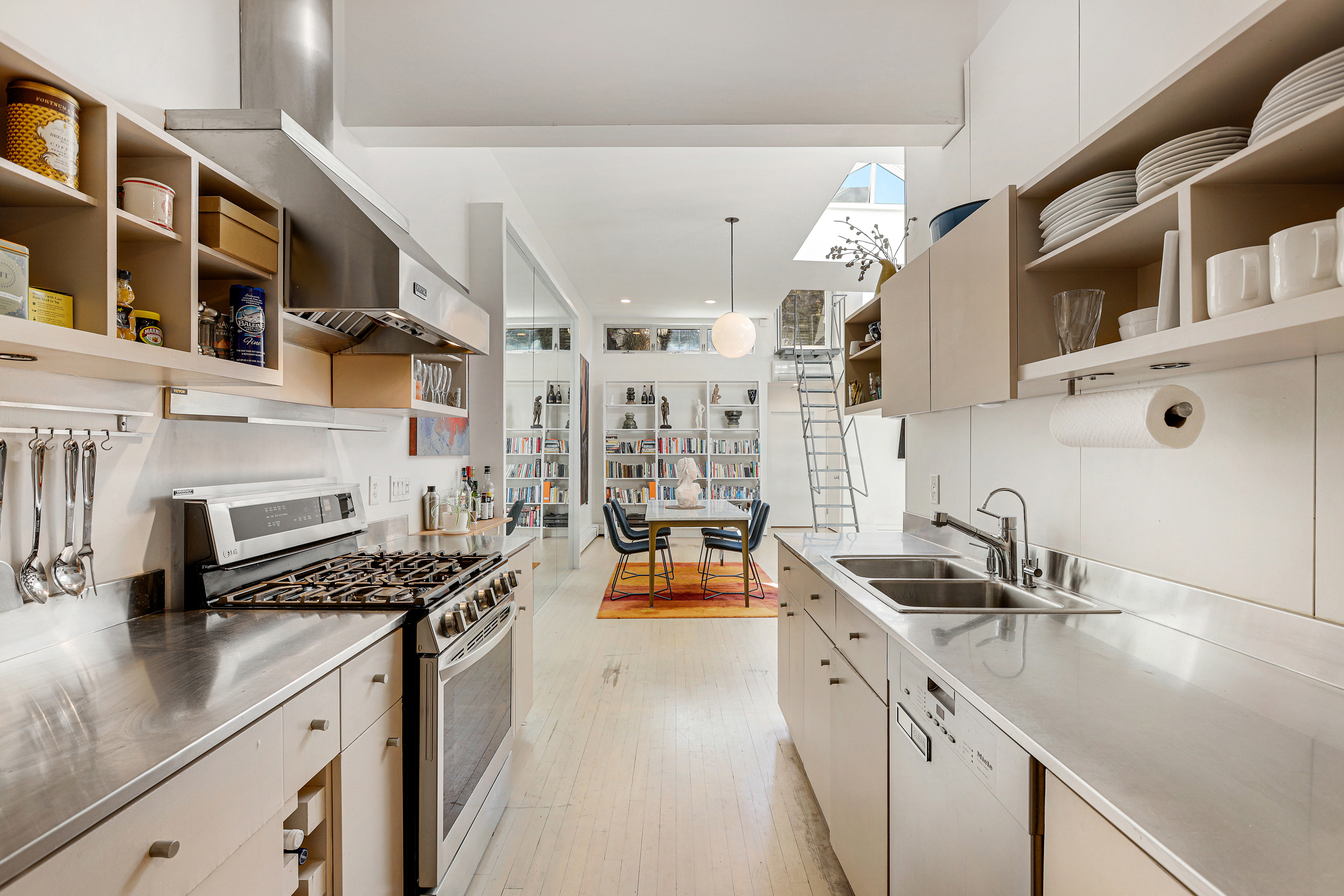 56 Bergen Street, Unit 1R Brooklyn, NY 11201 - Photo 4 of 13 a kitchen with stainless steel appliances a sink stove and cabinets