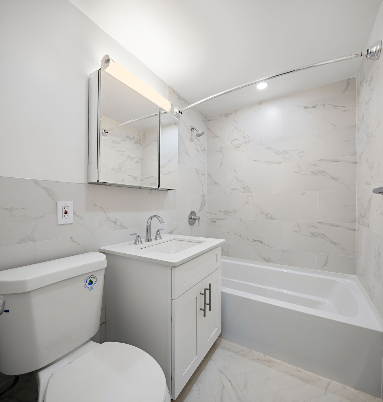 400 East 54th Street, Unit 19H Manhattan, NY 10022 - Photo 11 of 15 a bathroom with a toilet sink and mirror