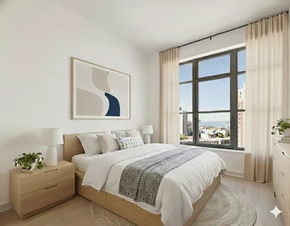 a bedroom with a bed and a large window