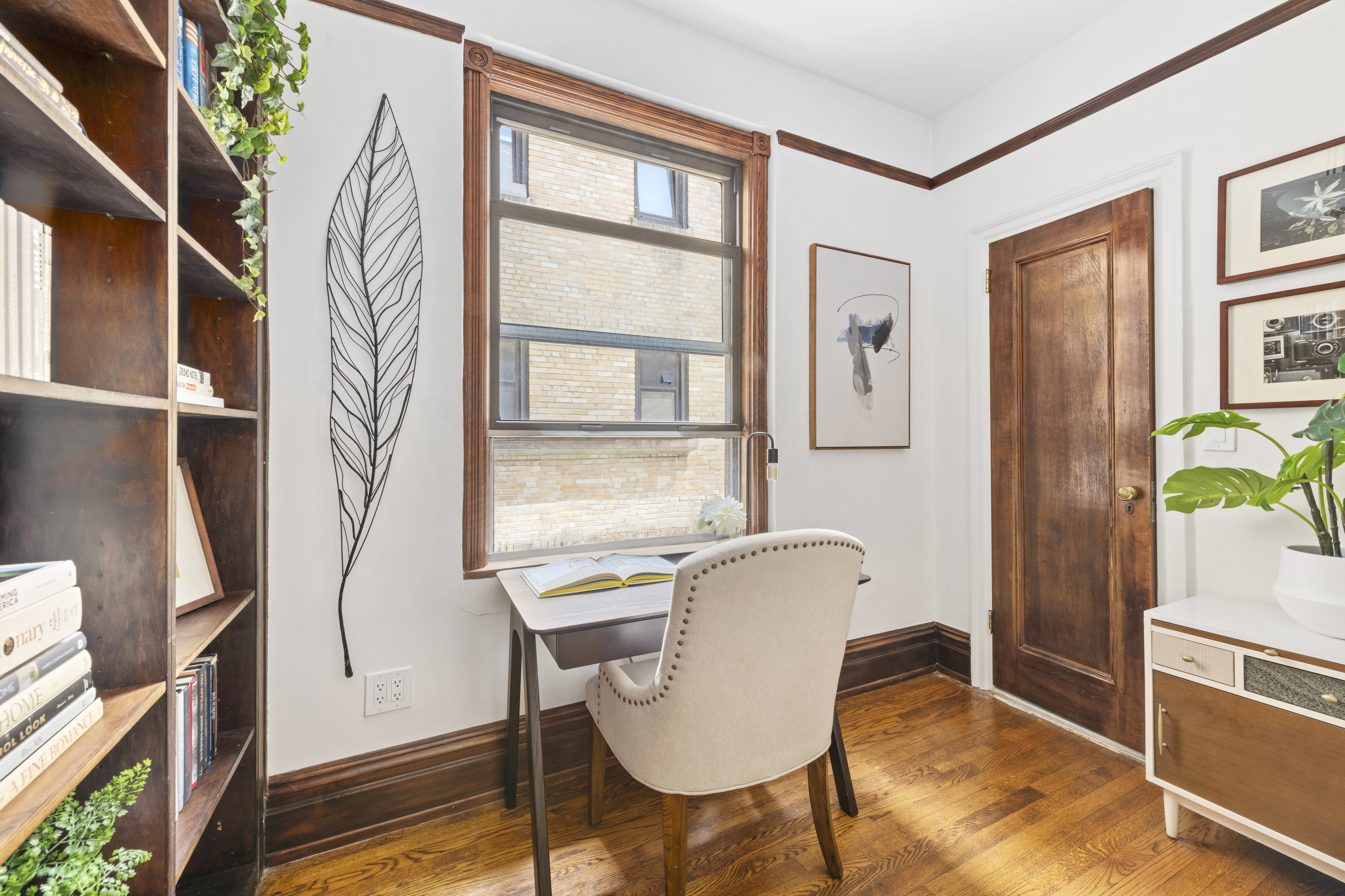 410 East 57th Street, Unit 15BE Manhattan, NY 10022 - Photo 8 of 18 a view of a workspace with furniture and a window