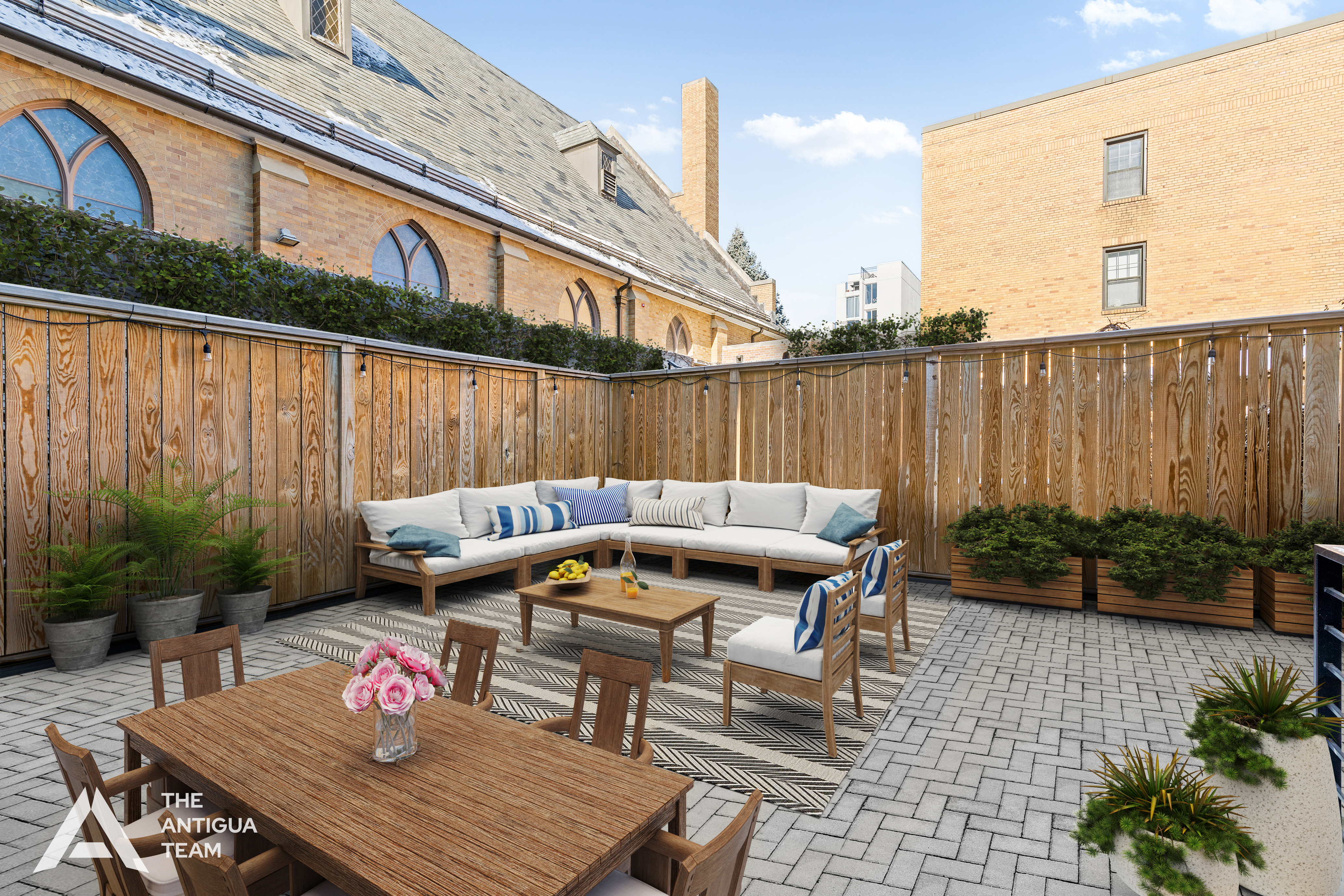 a view of a patio with table and chairs potted plants with wooden floor