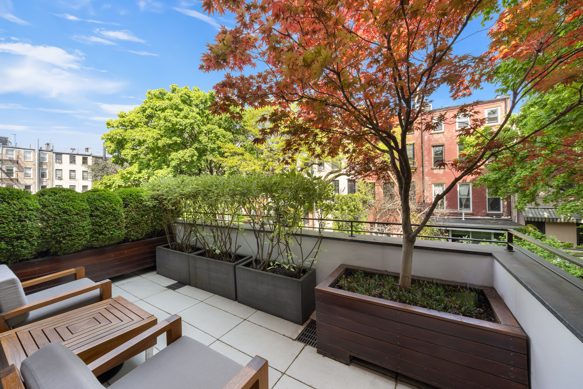 67 Charles Street Manhattan, NY 10014 - Photo 11 of 15 a view of outdoor space with seating and trees