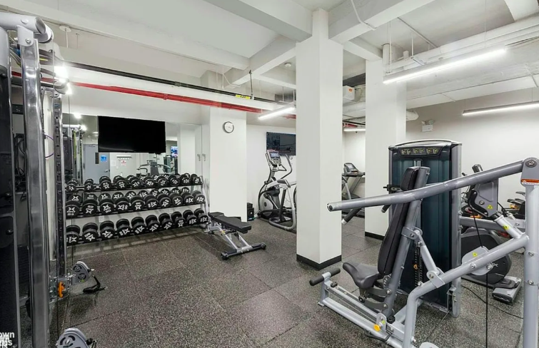 445 East 86th Street, Unit 6D Manhattan, NY 10028 - Photo 7 of 11 a view of a room with gym equipment