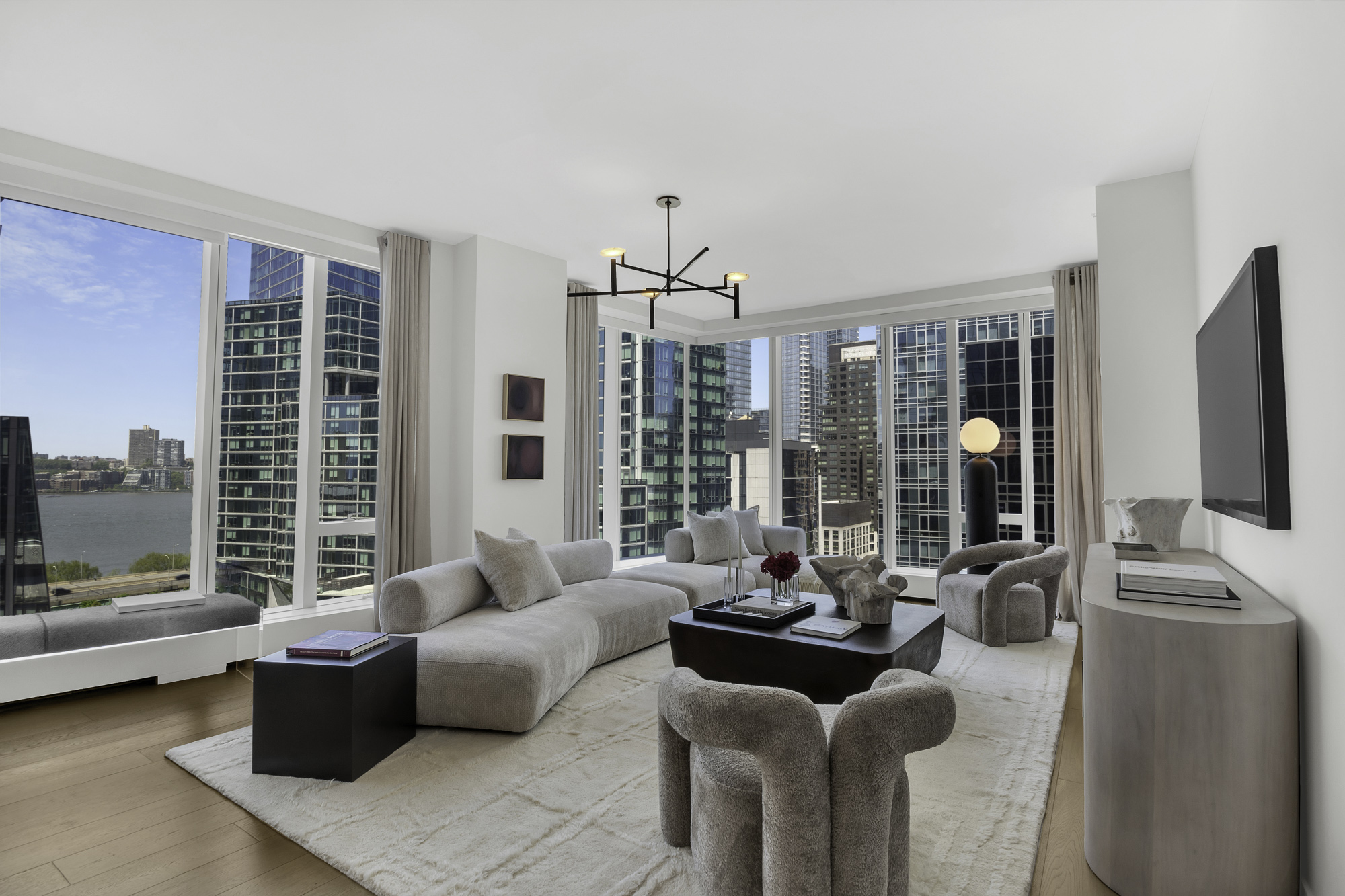 1 West End Avenue, Unit 10A Manhattan, NY 10023 - Photo 2 of 38 a living room with furniture and large windows