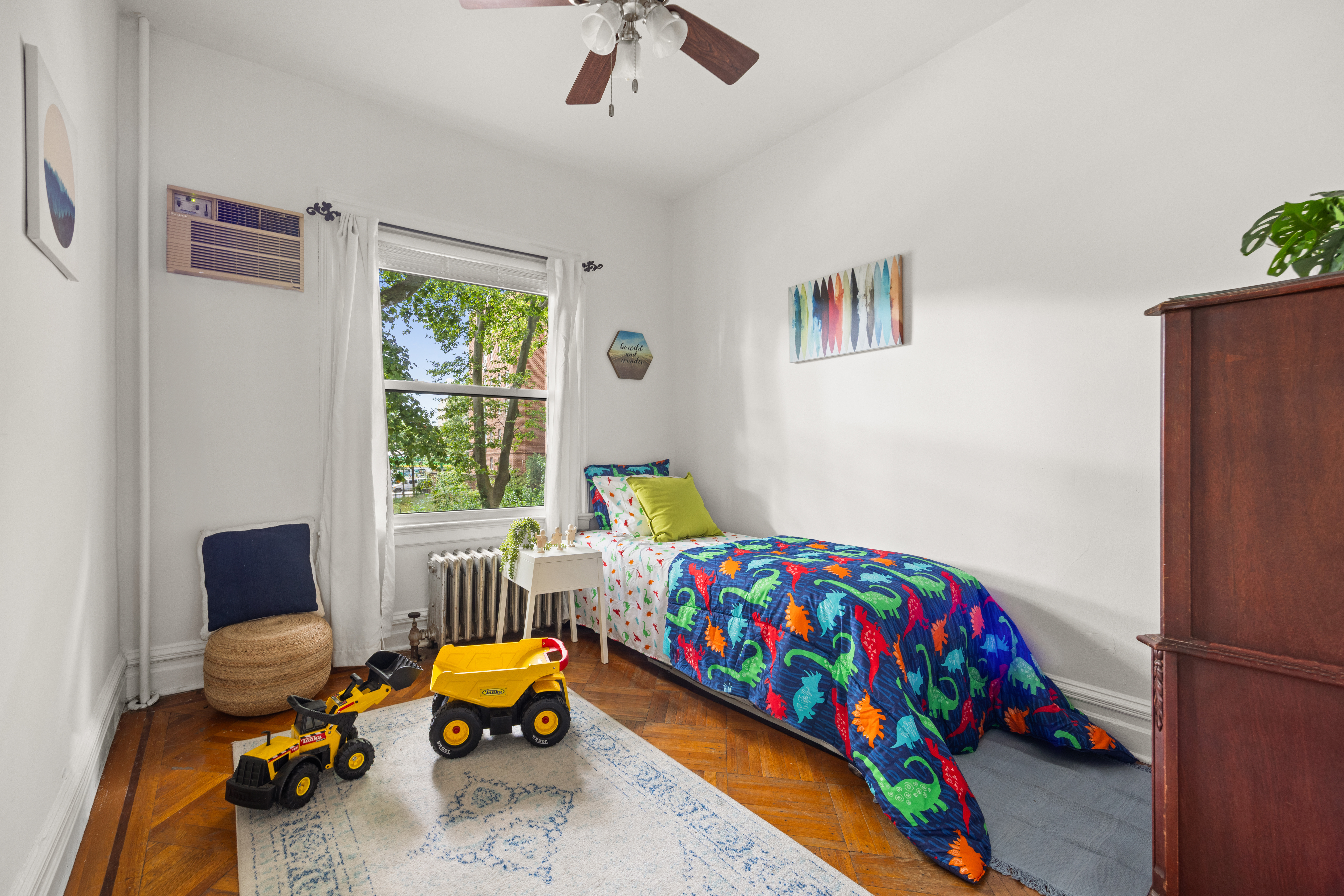 481 Stratford Road Brooklyn, NY 11218 - Photo 15 of 25 a bedroom with a bed and wooden floor