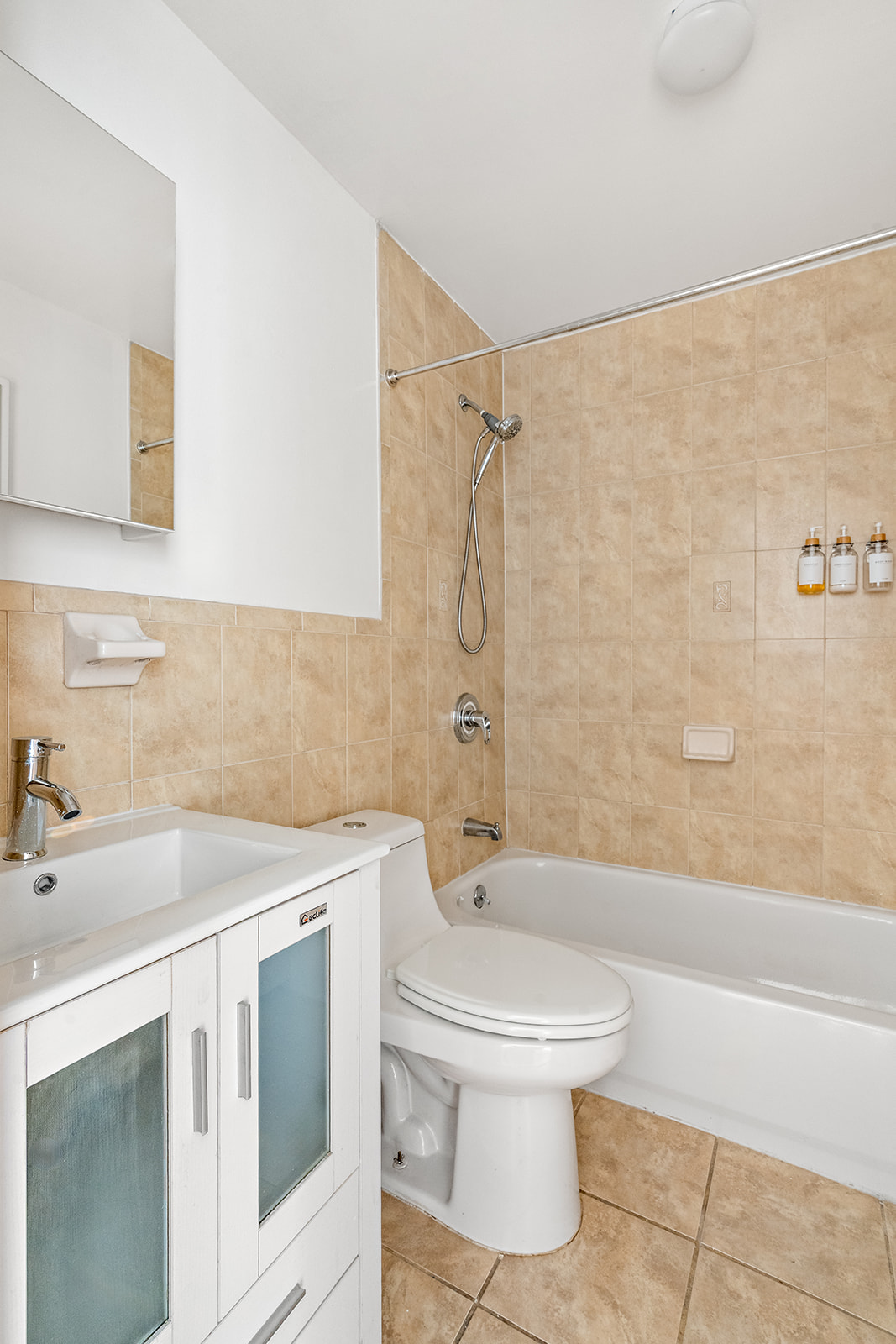 383 Bainbridge Street, Unit 1 Brooklyn, NY 11233 - Photo 9 of 14 a bathroom with a sink toilet and shower