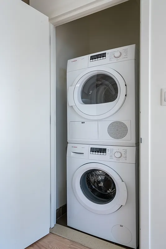 626 Flatbush Avenue, Unit 12D Brooklyn, NY 11225 - Photo 4 of 18 a utility room with dryer and washer