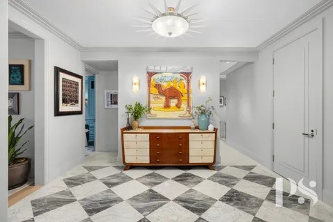 a view of room with window and furniture