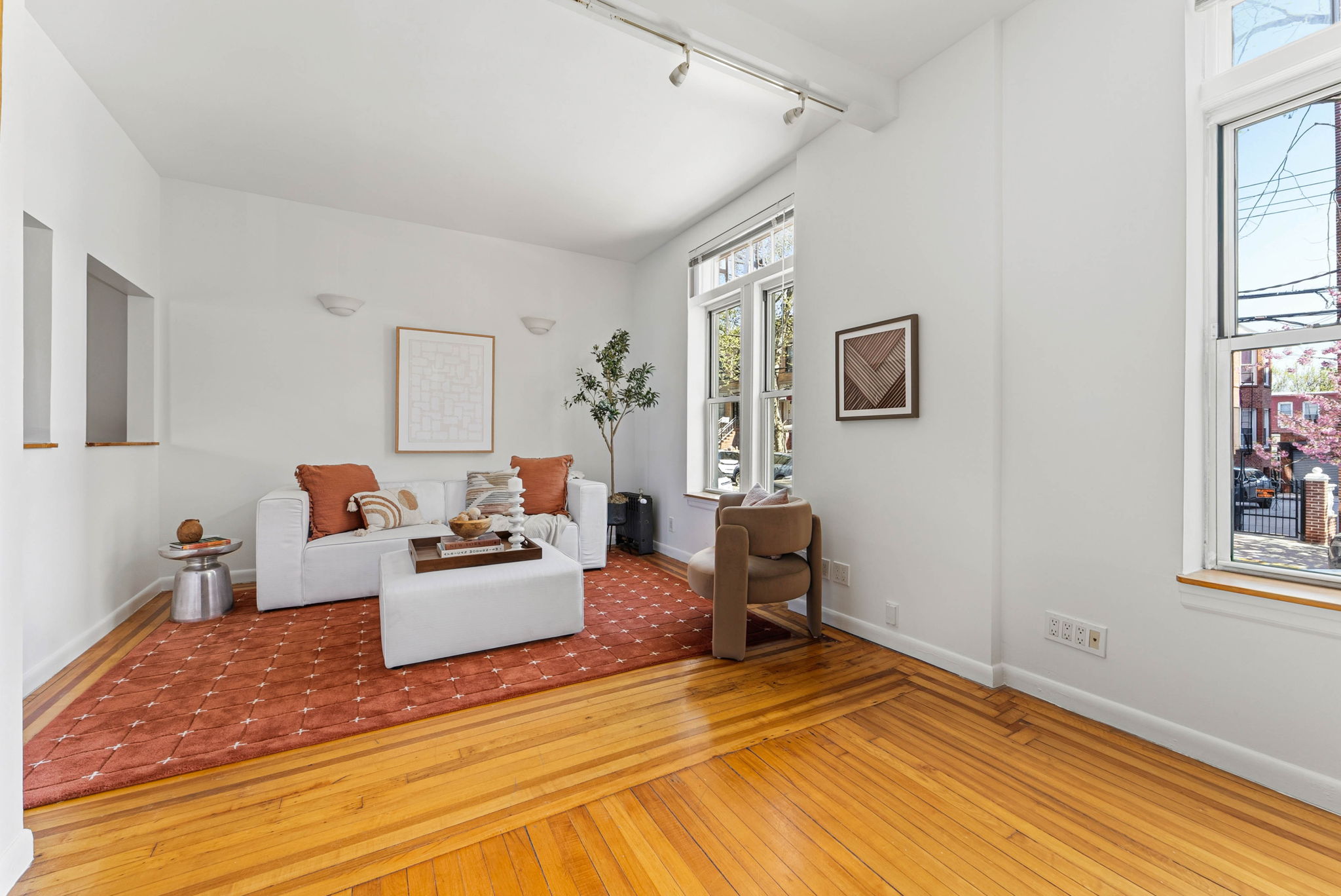 826 43rd Street, Unit 1 Brooklyn, NY 11232 - Photo 1 of 12 a bedroom with a bed and wooden floor